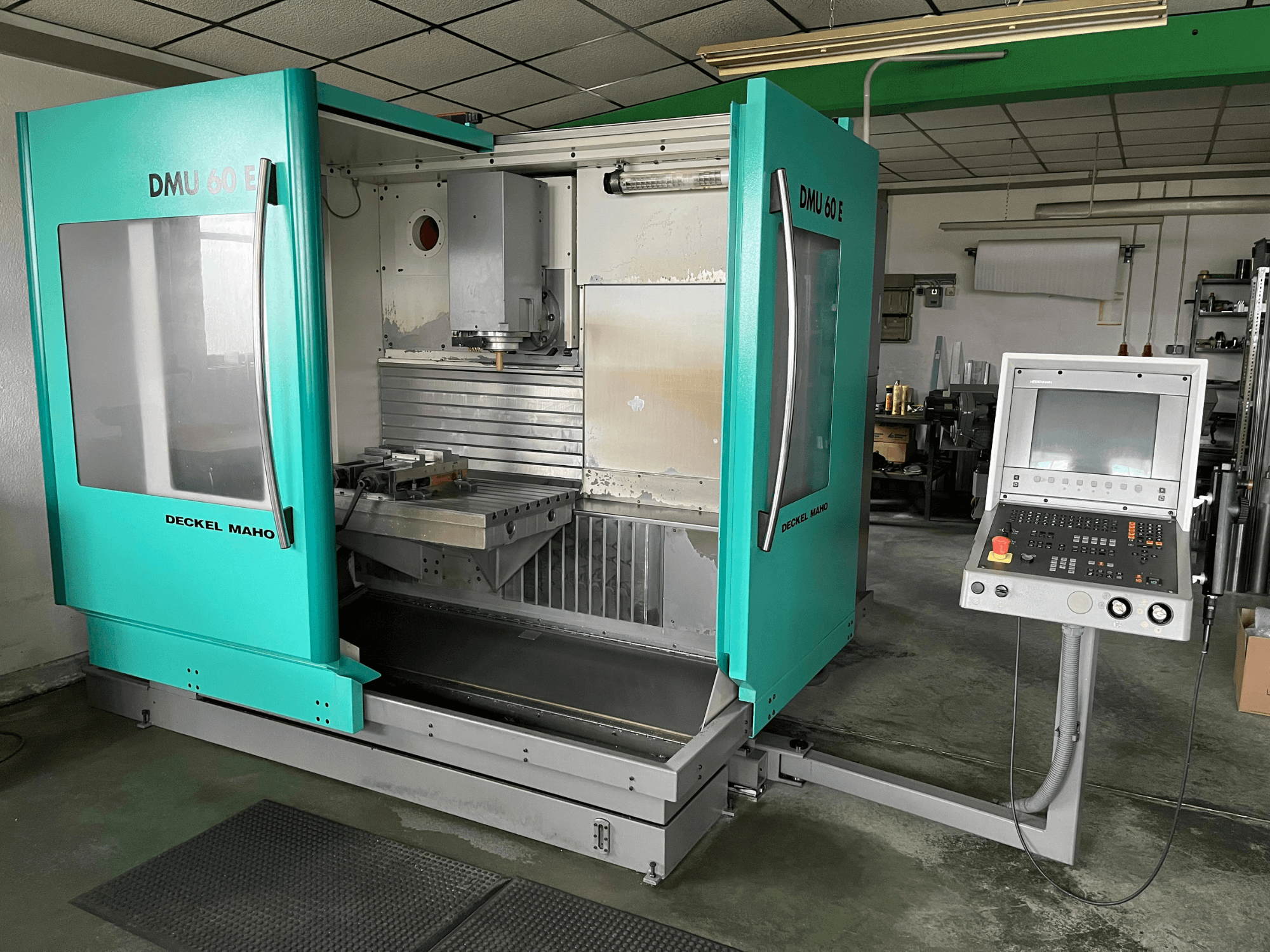 DECKEL DMU 60 E vertical machining centre in a front view, showcasing control panel and spindle head for precision machining tasks.