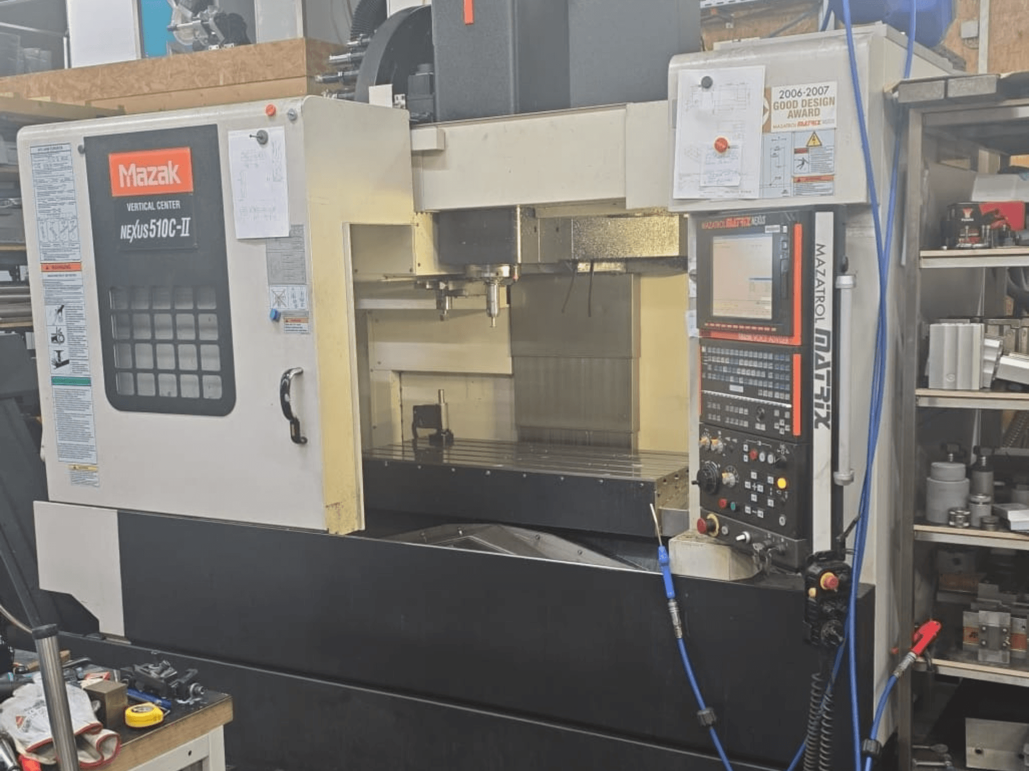 Mazak VERTICAL CENTER NEXUS 510C-II, front view showing control panel, machining area, and operational features.