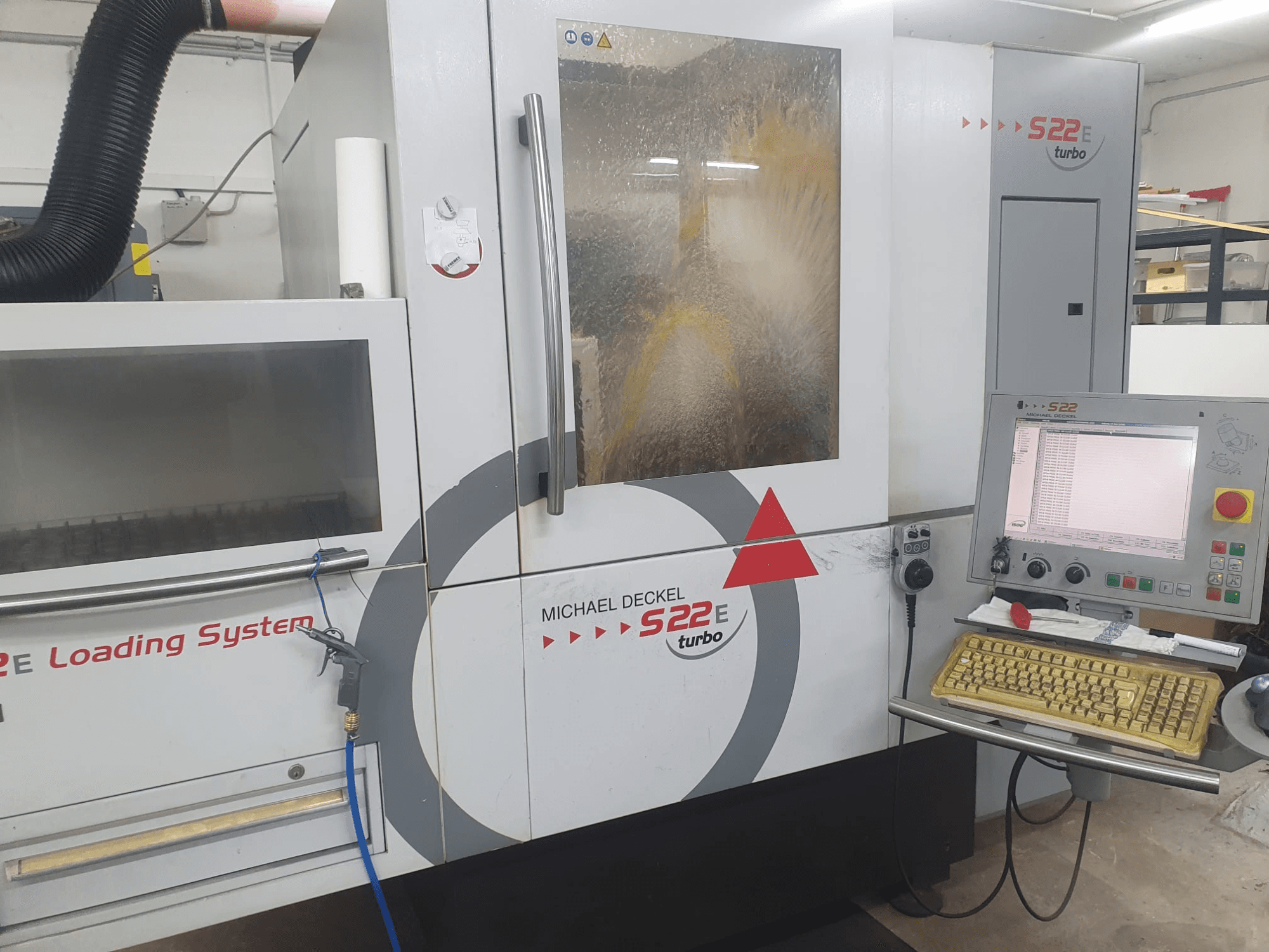 Michael Deckel S22 internal grinding machine in front view, featuring a control panel and loading system.