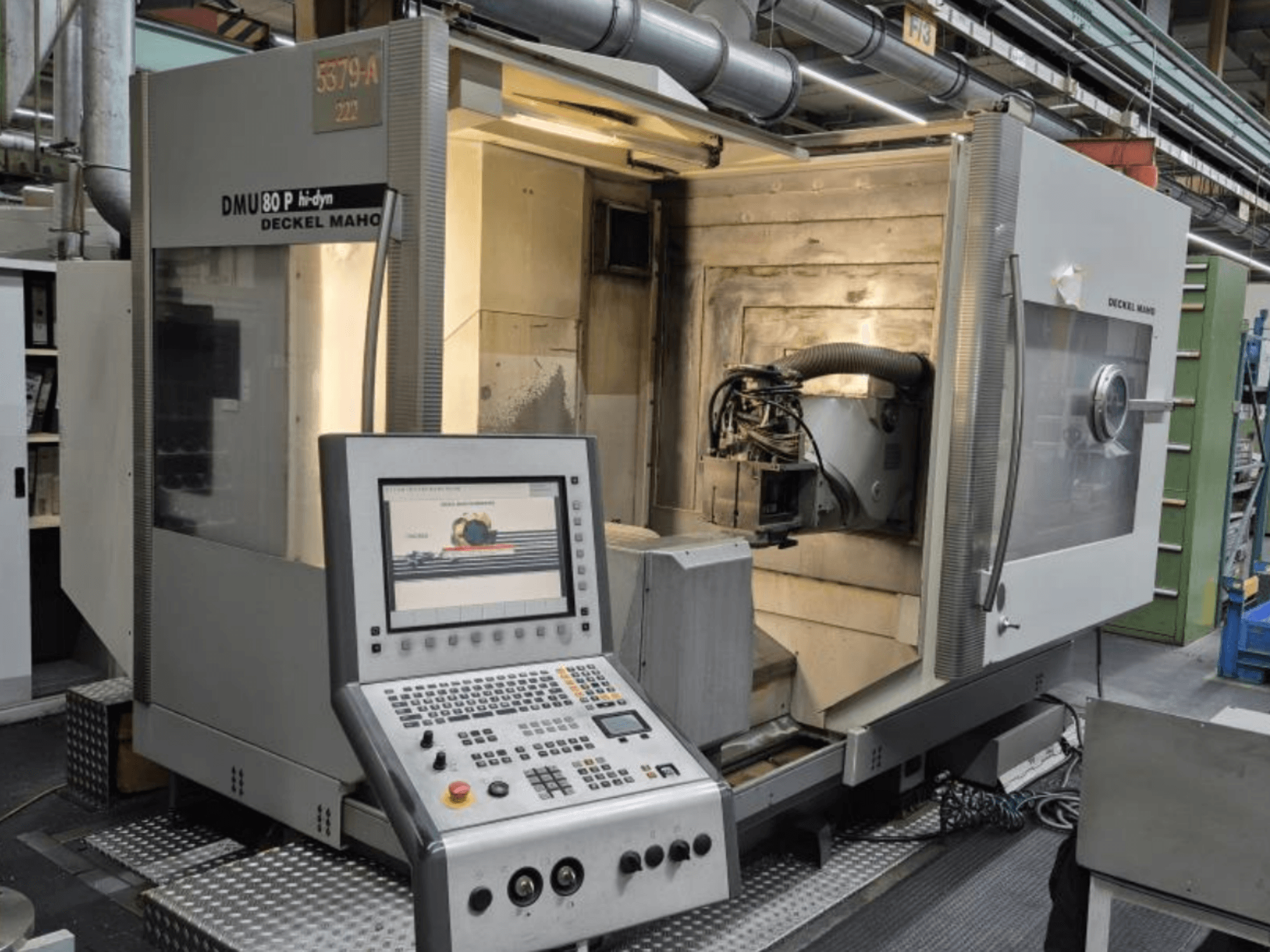 Universal Machining Centre DECKEL MAHO DMU 80P hi-dyn, front view displaying control panel and interior workspace.