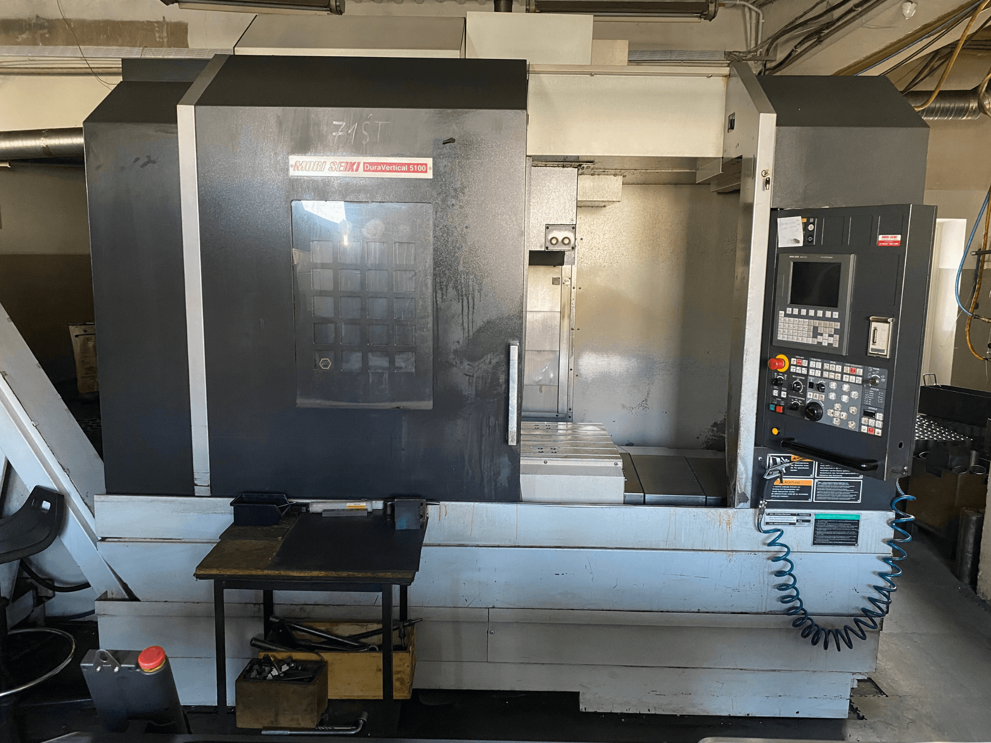 MORI SEIKI DuraVertical 5100 from a front view, showcasing control panel, working area, and machine details.