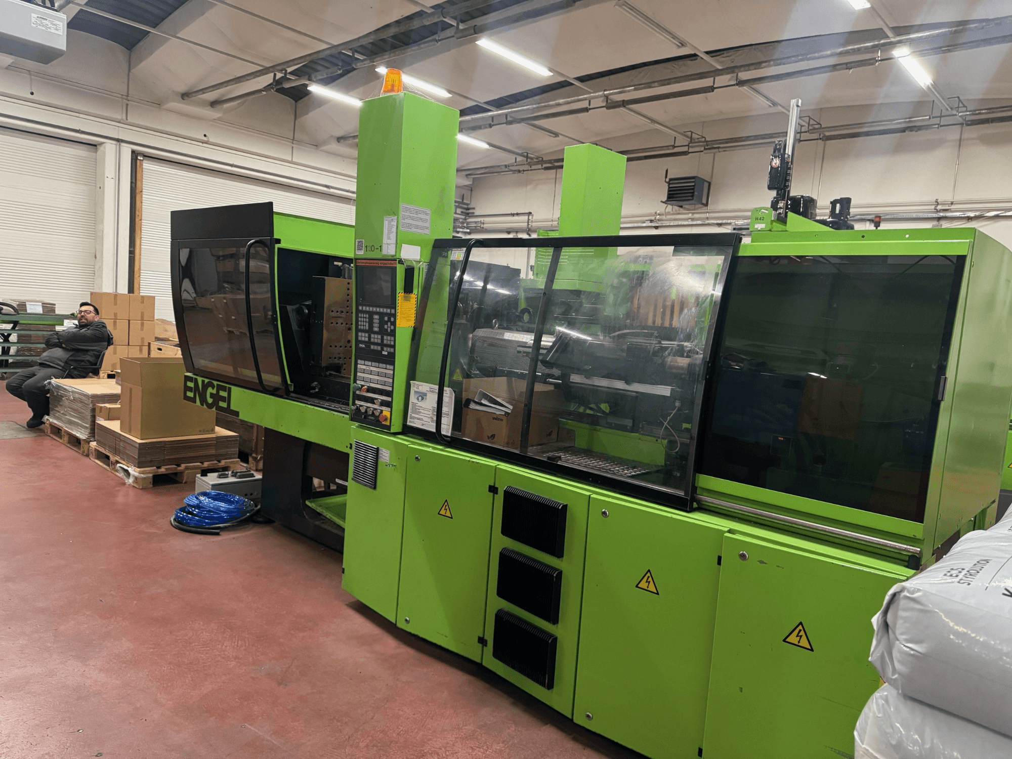 Engel VICTORY 500/120 hydraulic injection moulding machine, front view, green color, with control panel and safety features visible.