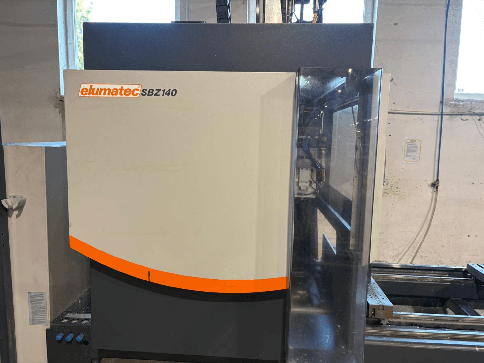 Elumatec SBZ-140 vertical machining centre, front view, showcasing its sleek design and control panel details.