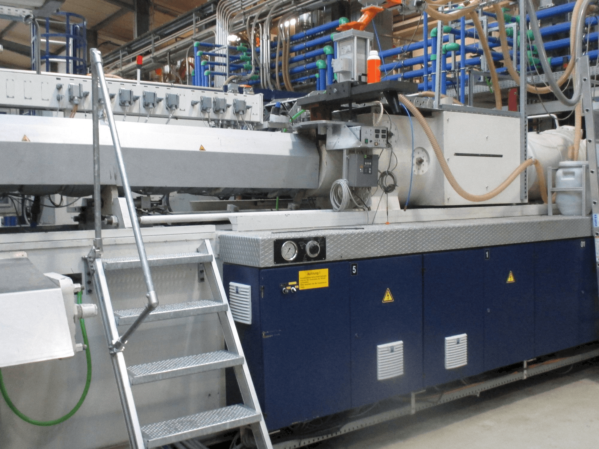 Front view of Krauss Maffei 1300/14700 MC machine