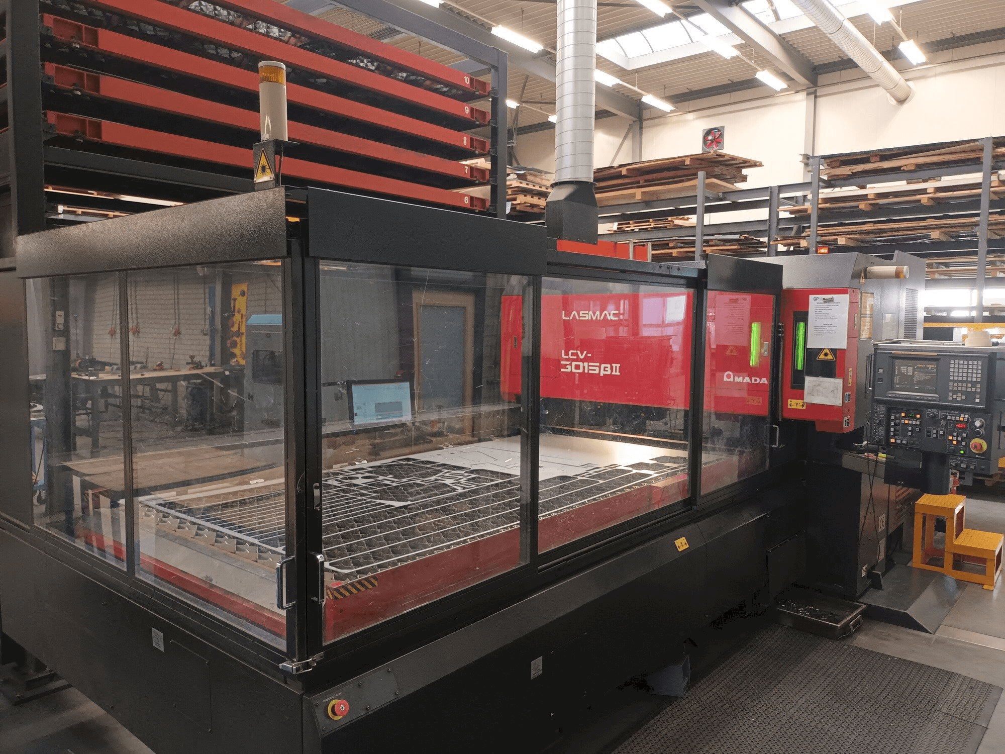 Front view of AMADA LCV 3015 3KW + Automation/storage machine