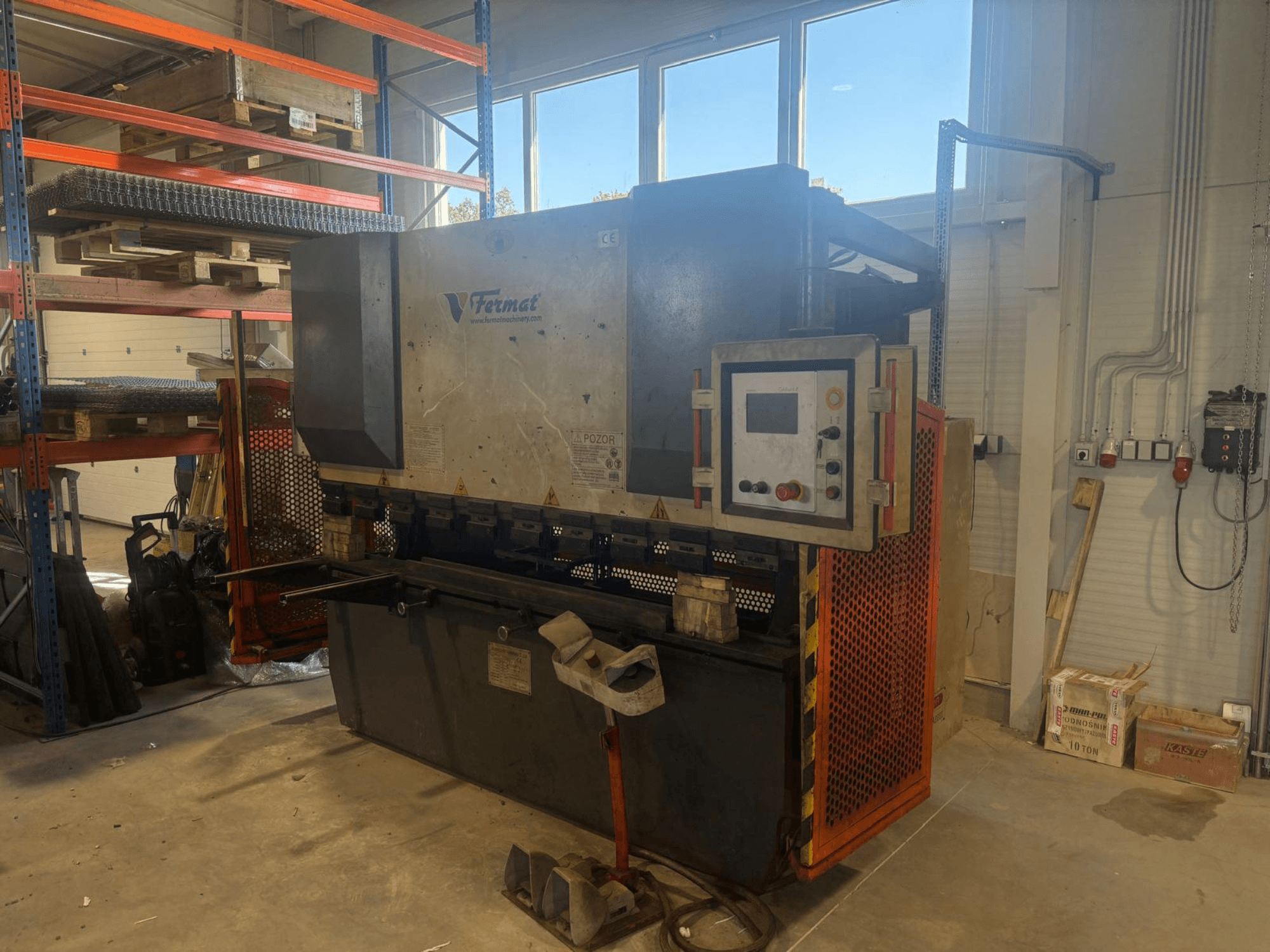 FERMAT CTOF 80/2500 CNC press brake shown from the side, displaying control panel and metal bending tools.