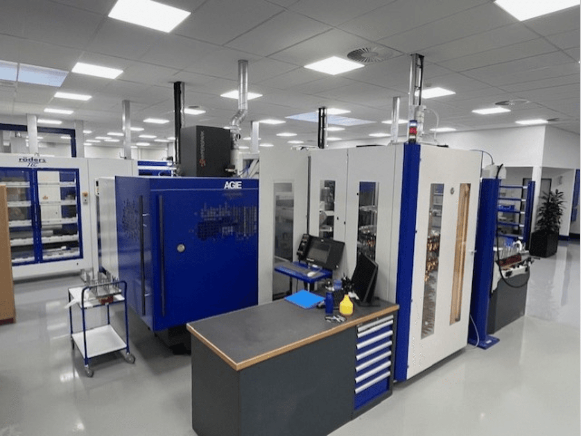 AGIE Hyperspark 2 Exact die-sinking EDM machine in a workshop, shown from a front angle with blue and gray accents.