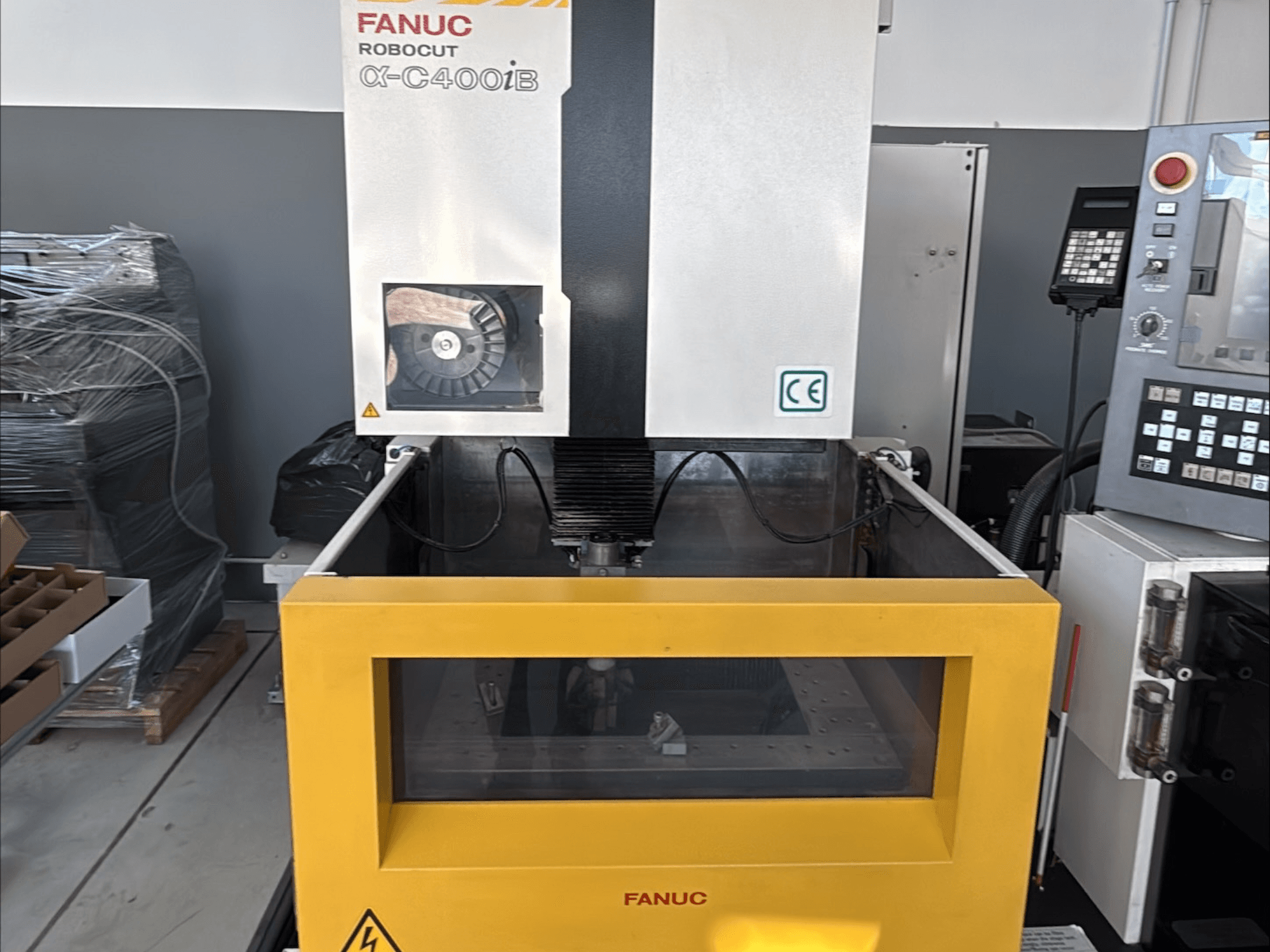 FANUC Robocut α-C400iB Wire EDM Machine, front view, featuring a yellow tank and control panel.