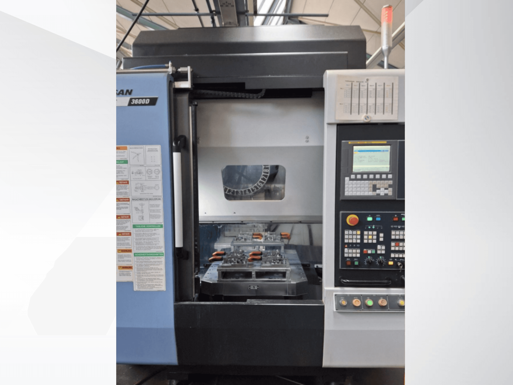 DOOSAN T 3600 D vertical turning machine in front view, showcasing control panel and work area with tools.