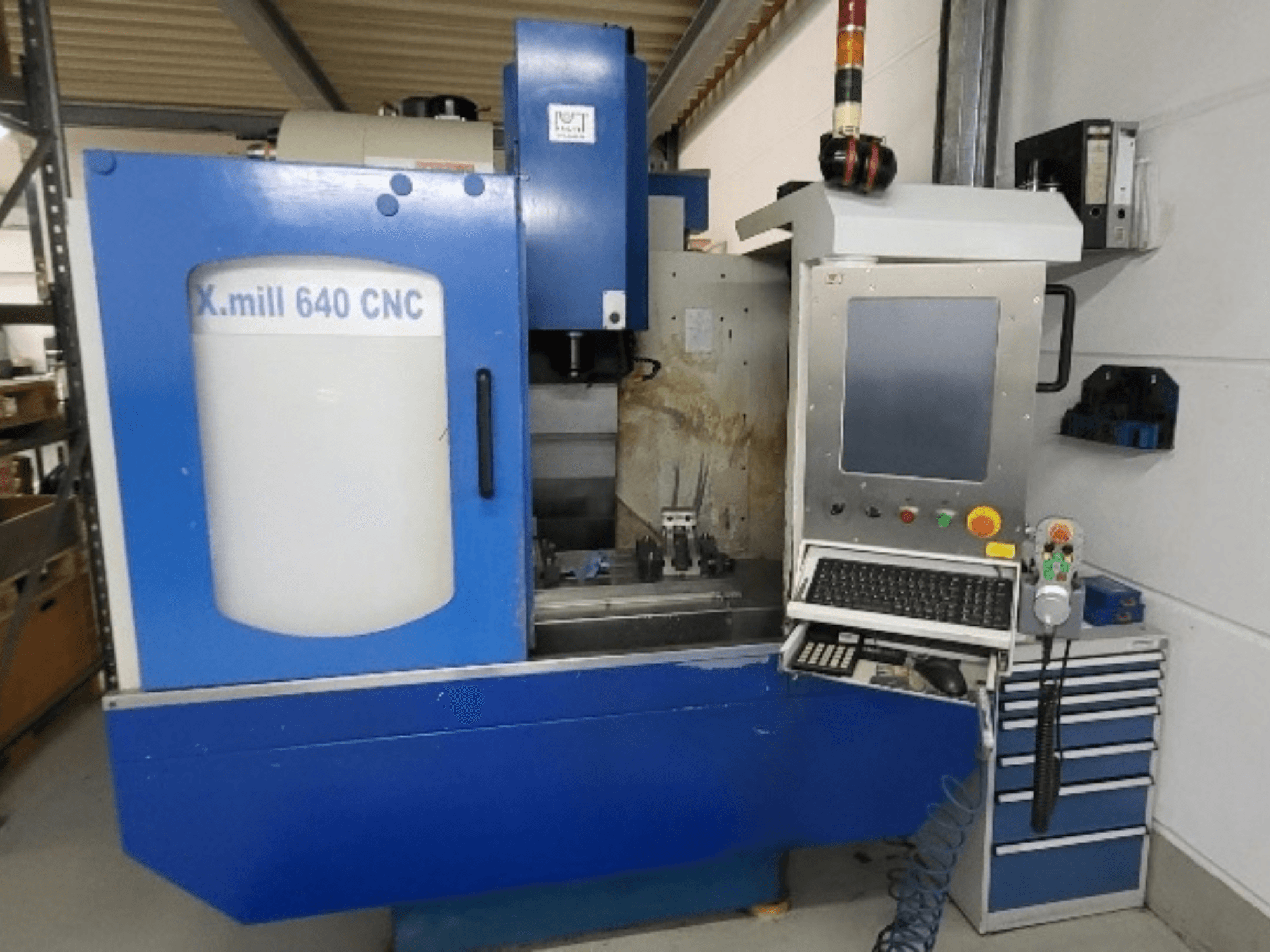 Blue KNUTH X-mill 640 CNC vertical machining center, front view with control panel and keyboard visible.