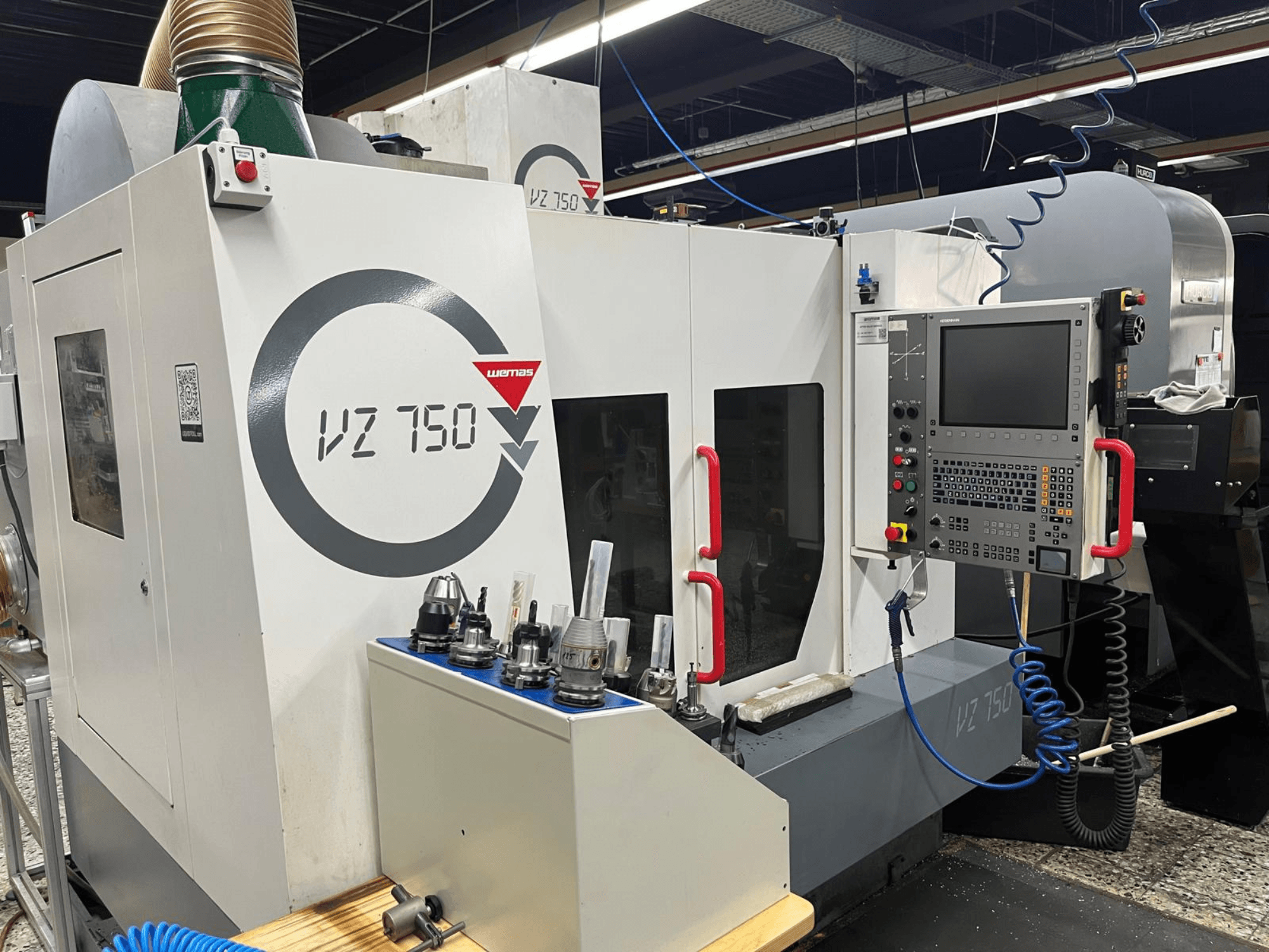 WEMAS VZ 750 Vertical Machining Centre, front view, showcases control panel, tool holders, and machine design details.
