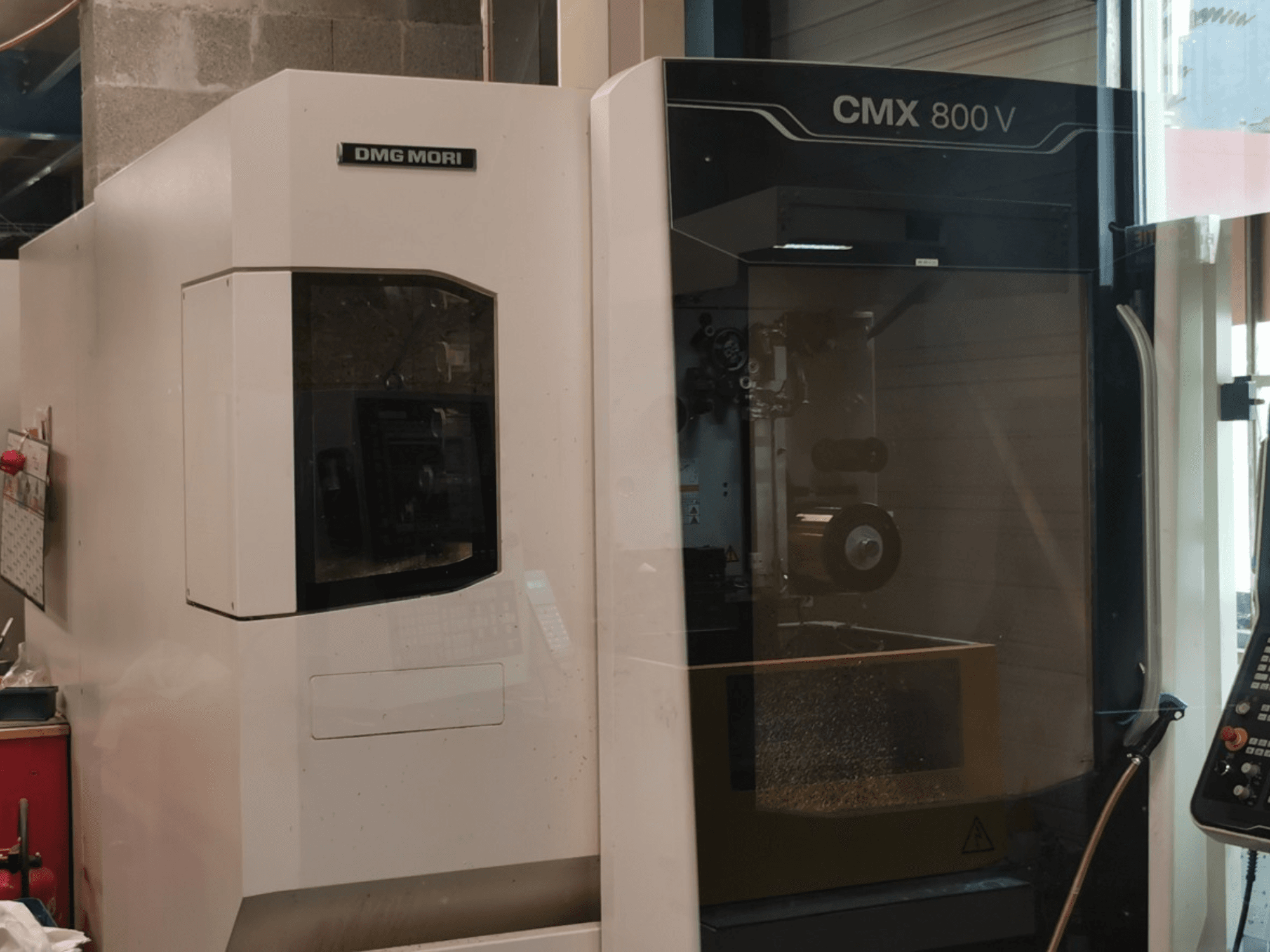 DMG Mori Seiki CMX 800 V vertical machining center, front view showing control panel and work area with visible tooling.