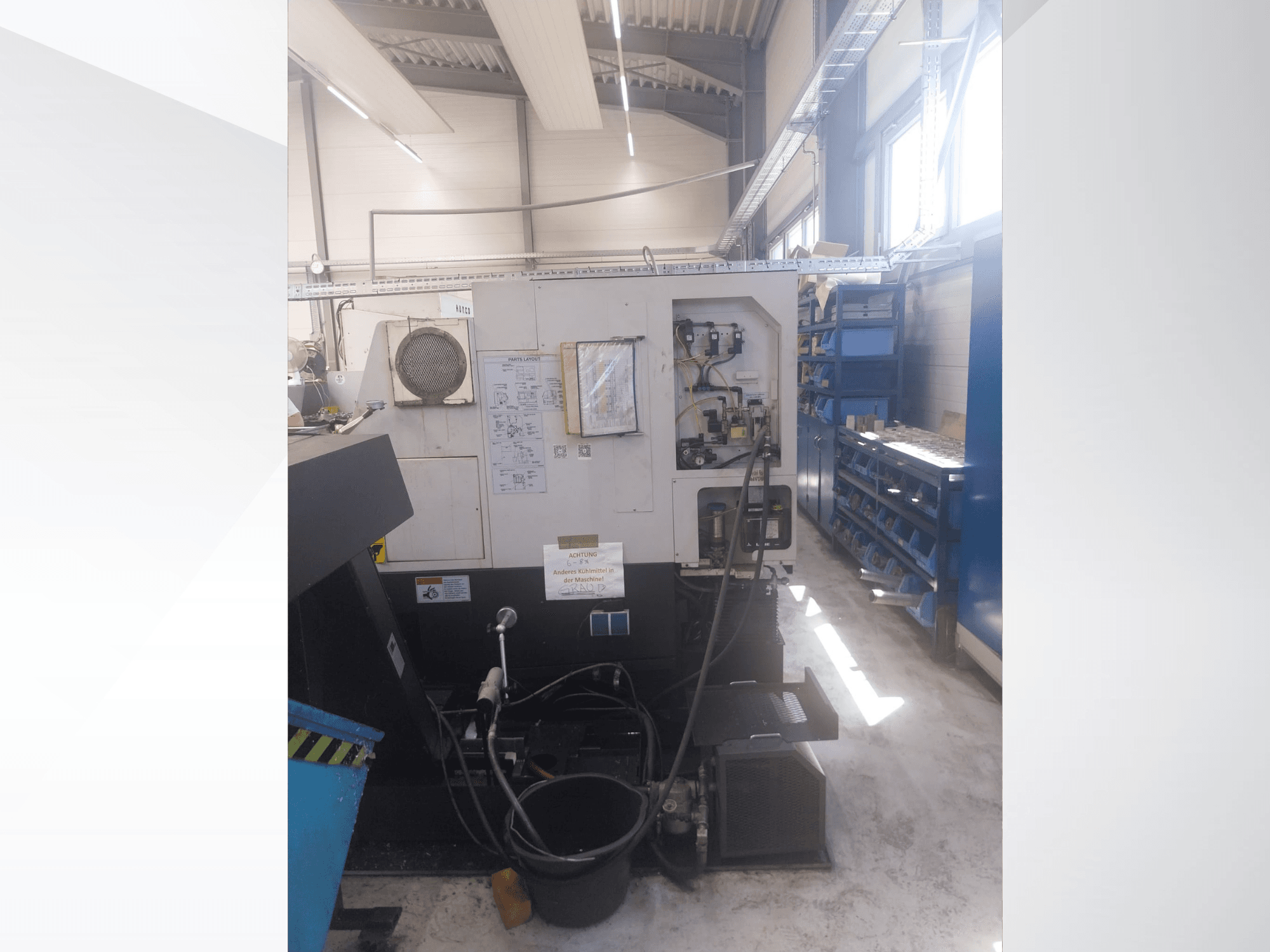 Mazak QUICK TURN NEXUS 200 MS, side view showing control panel, hoses, and tool area in a workshop setting.