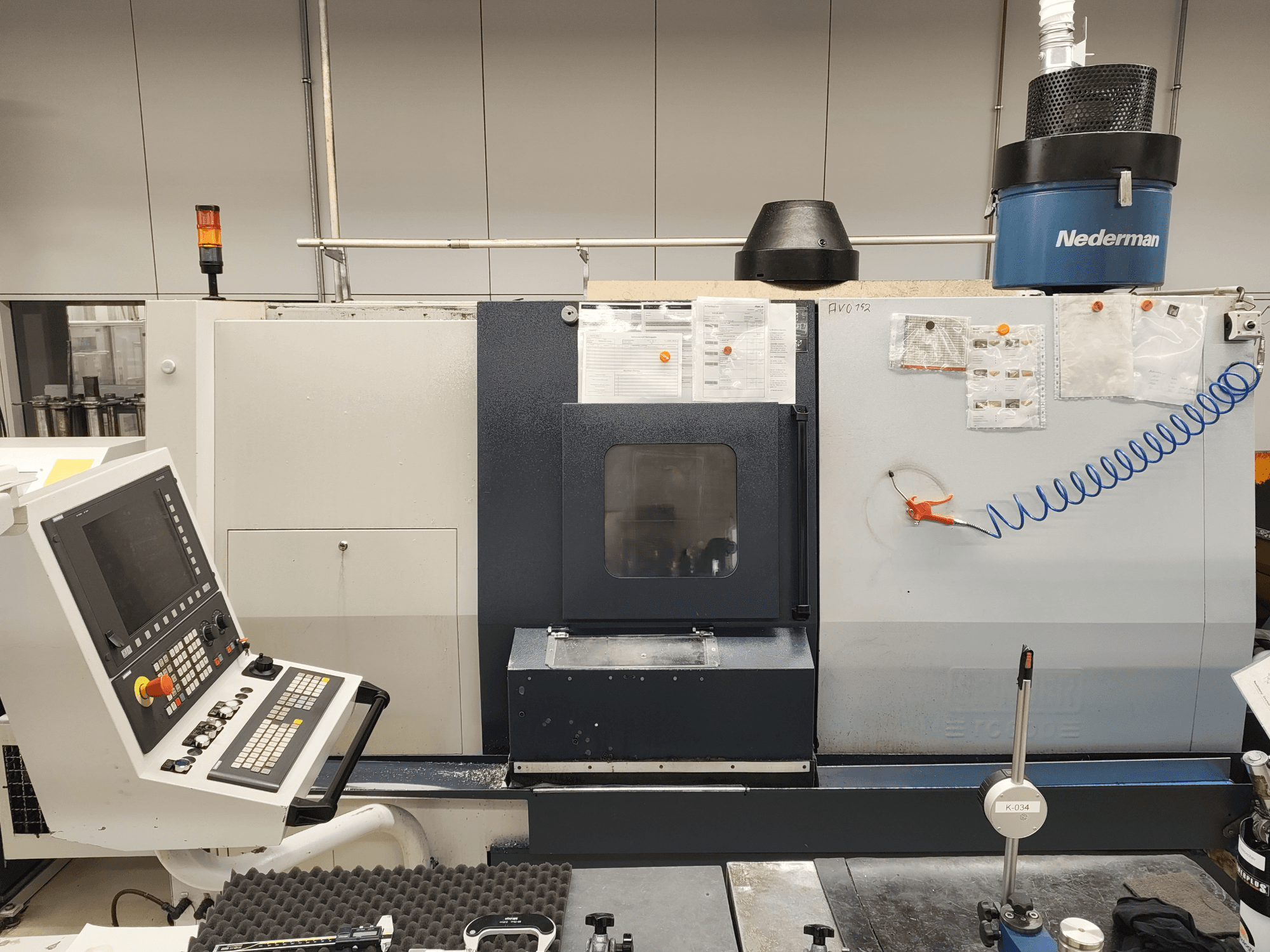 Front view of SPINNER TC 800 110 MC horizontal turning machine with control panel, tool storage, and operational indicators.