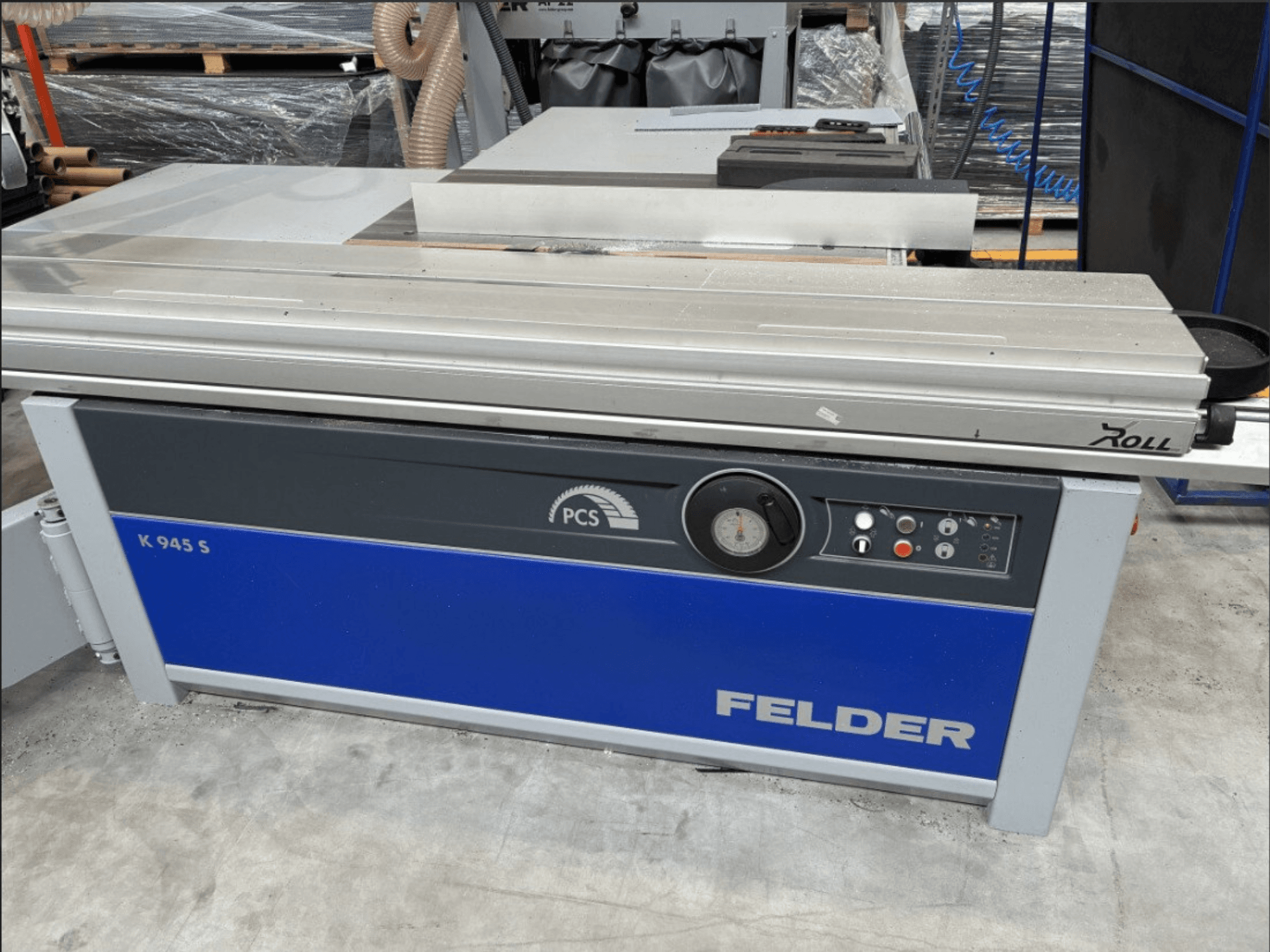 FELDER K 945 S panel saw, front view showing control panel, table, and safety features, set on a workshop floor.