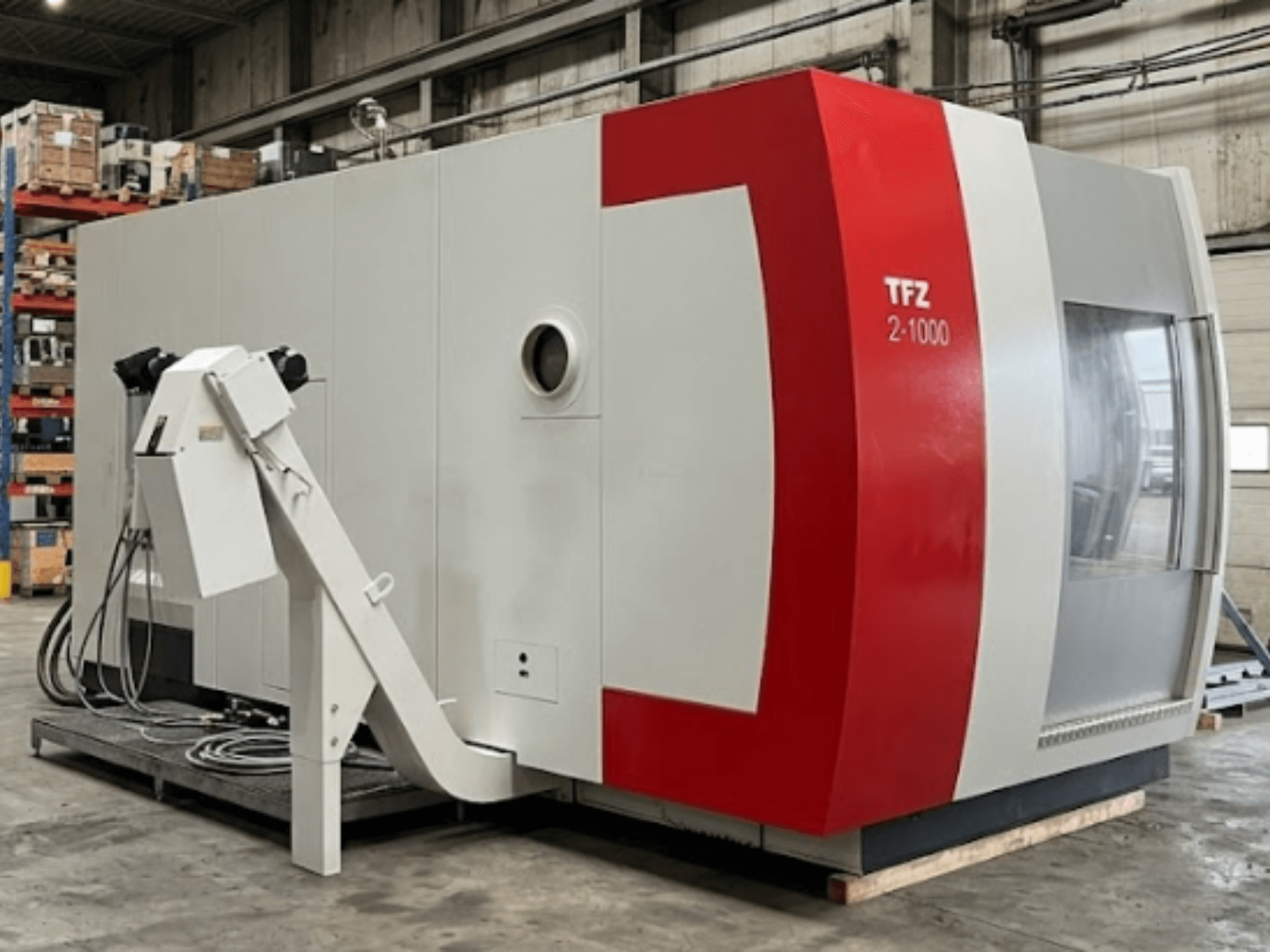 Universal Machining Centre SAMAG TFZ 2L-1000, side view showcasing its red and grey design and robotic arm attachment.