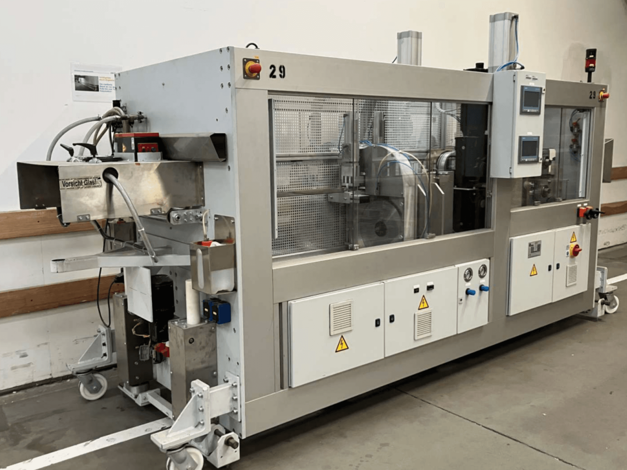 STEIN BAK10-D circular metal saw, side view, featuring control panel, safety labels, and transparent covers for visibility.