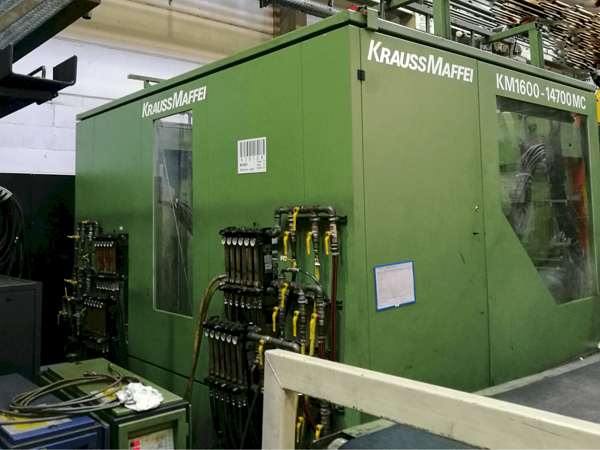 Left view of Krauss Maffei KM 1600-14700 MC Machine