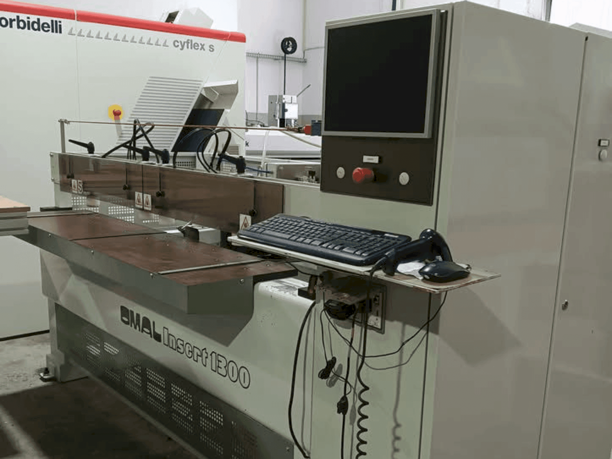 Front view of OMAL Insert 1300 machine