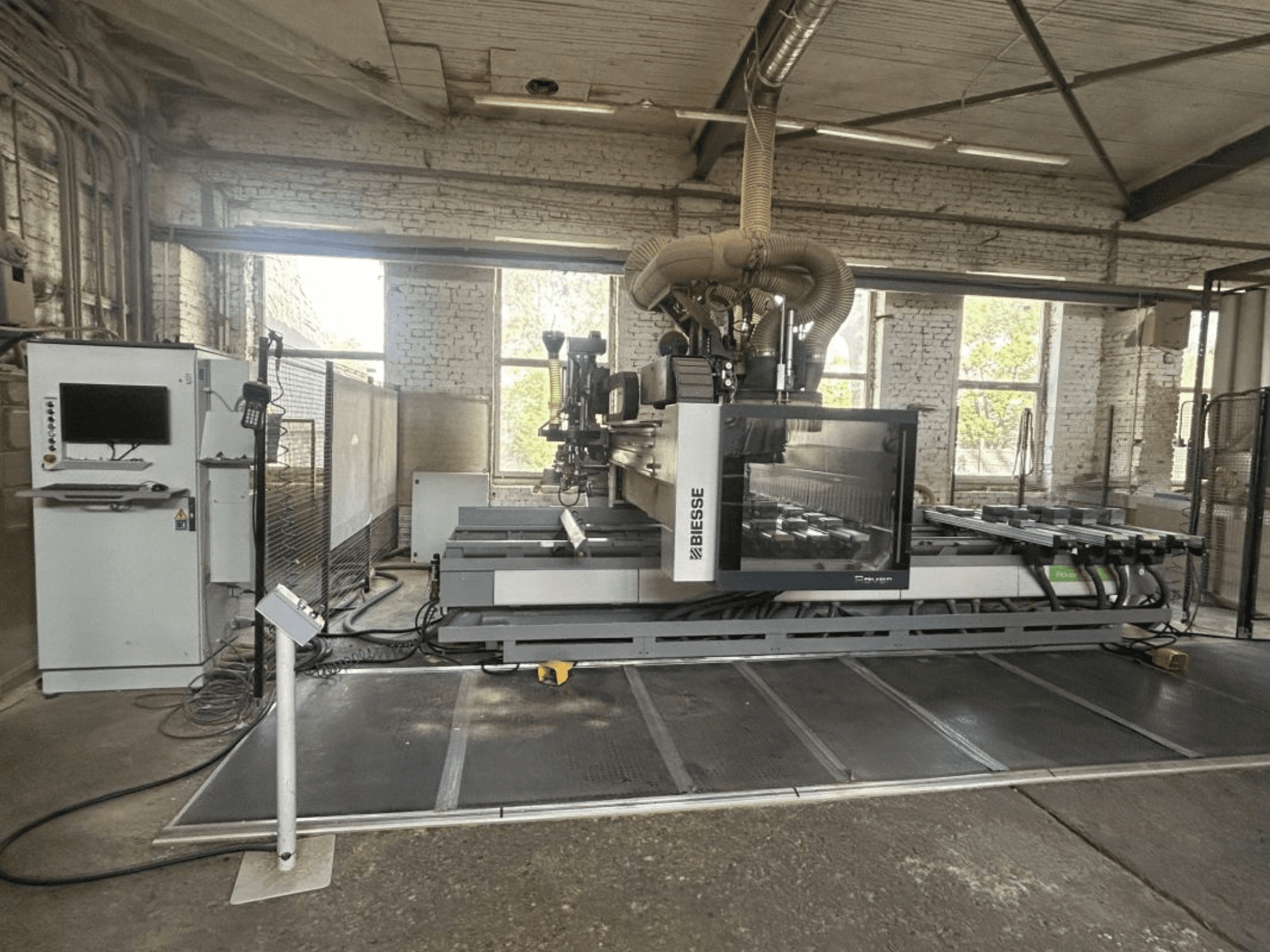 BIESSE Rover A Edge 1643 CNC processing center, front view, showcasing control panel, worktable, and industrial setting.