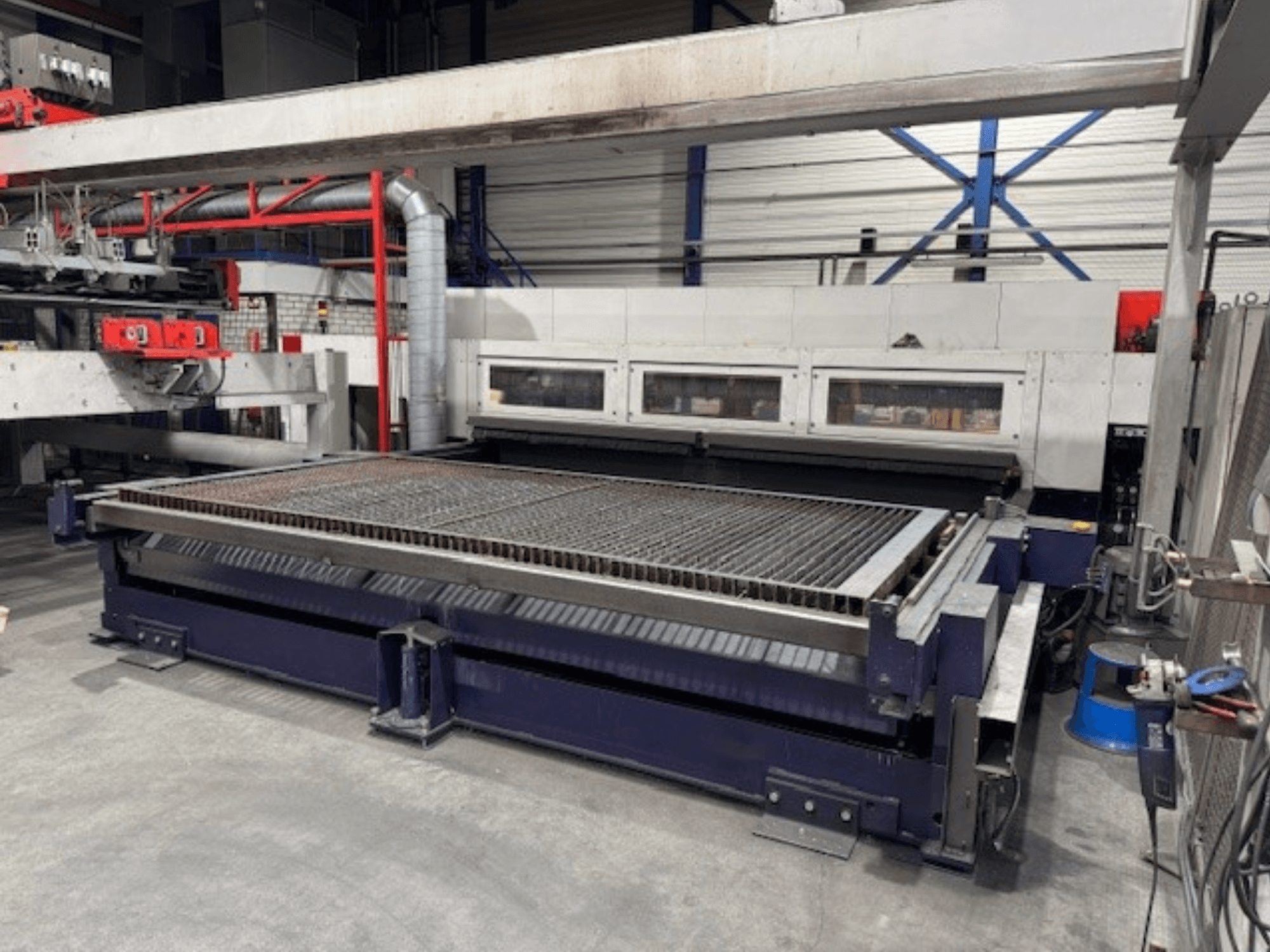 Bystronic BySpeed 4020 CO2 laser cutting machine in front view, featuring a spacious cutting table and mechanical components.