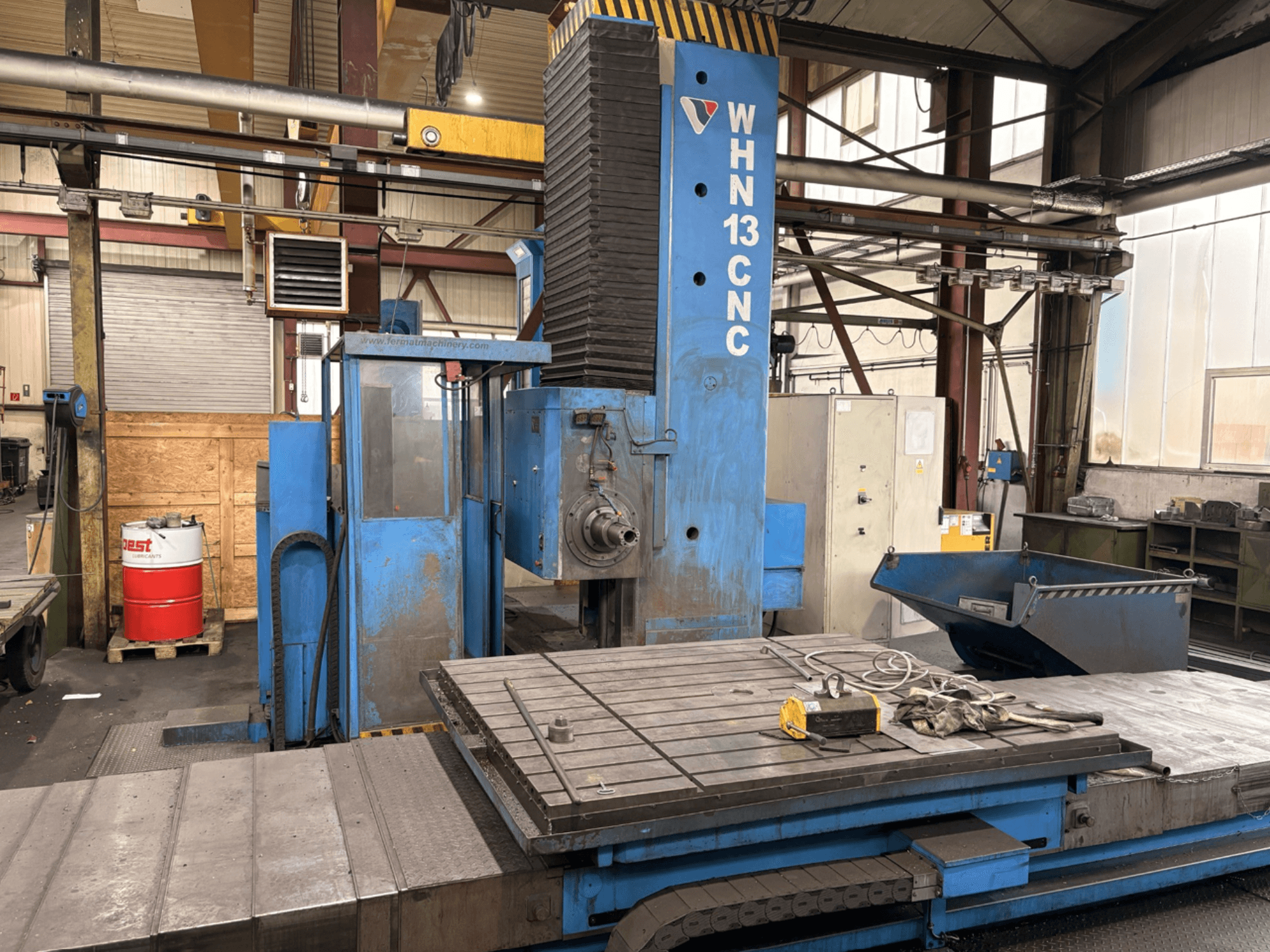 FERMAT WHN 13.8 CNC horizontal machining center, front view showing control panel, worktable, and industrial setting details.