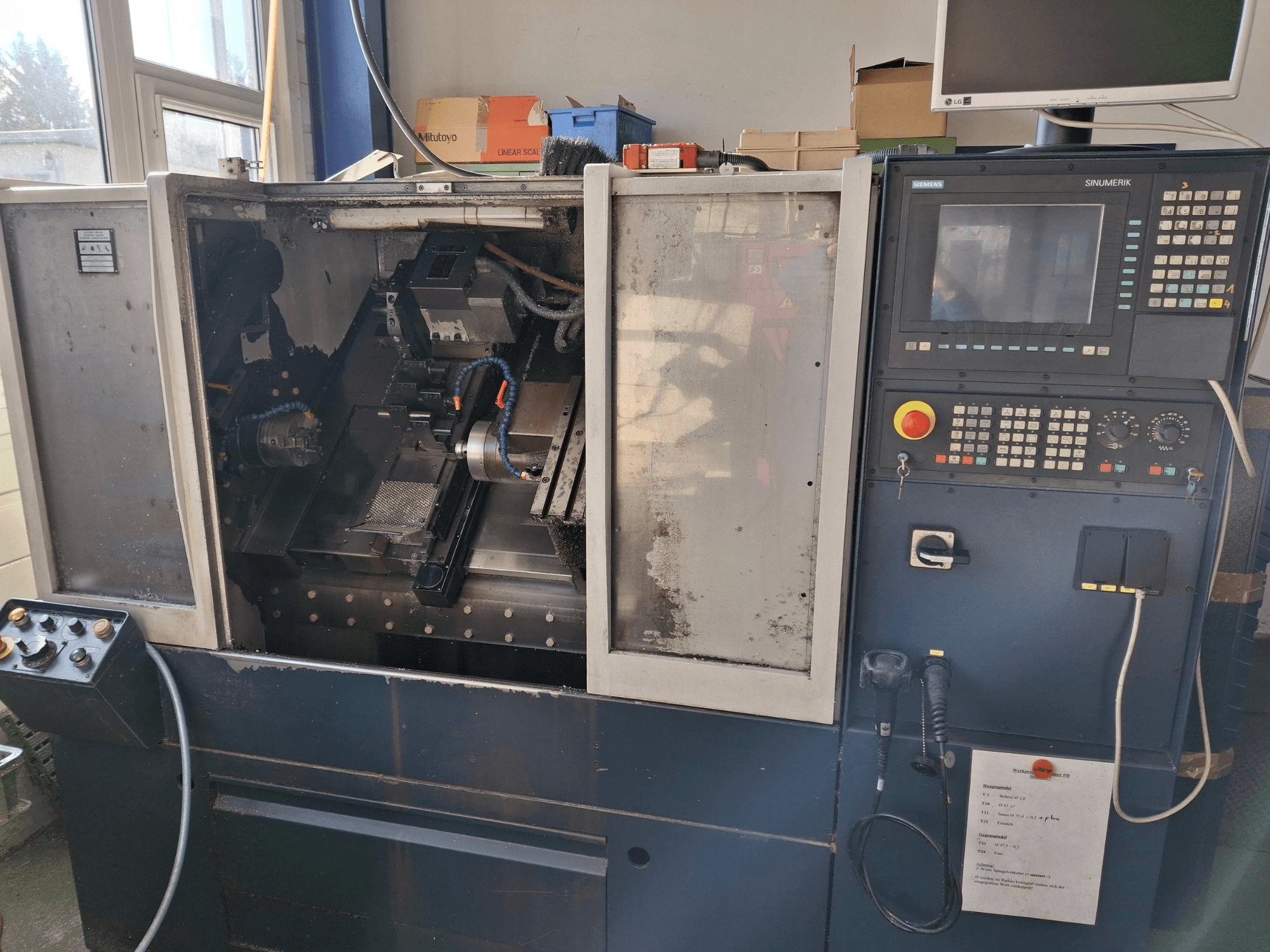 SPINNER PB horizontal turning machine, front view showing the work area, control panel, and operator interface.