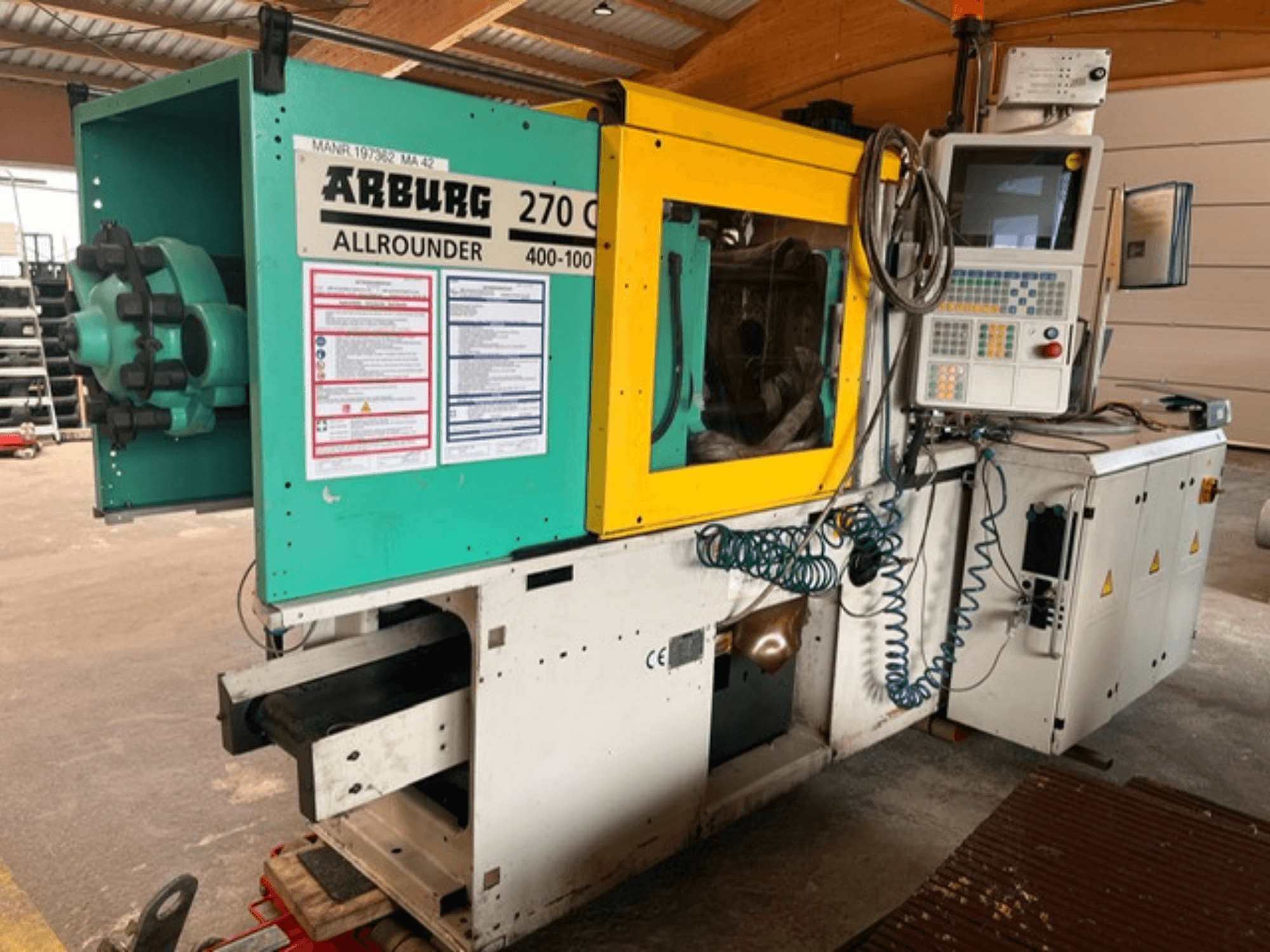 Front view of Arburg 270 C hydraulic injection moulding machine, featuring controls and operational details.