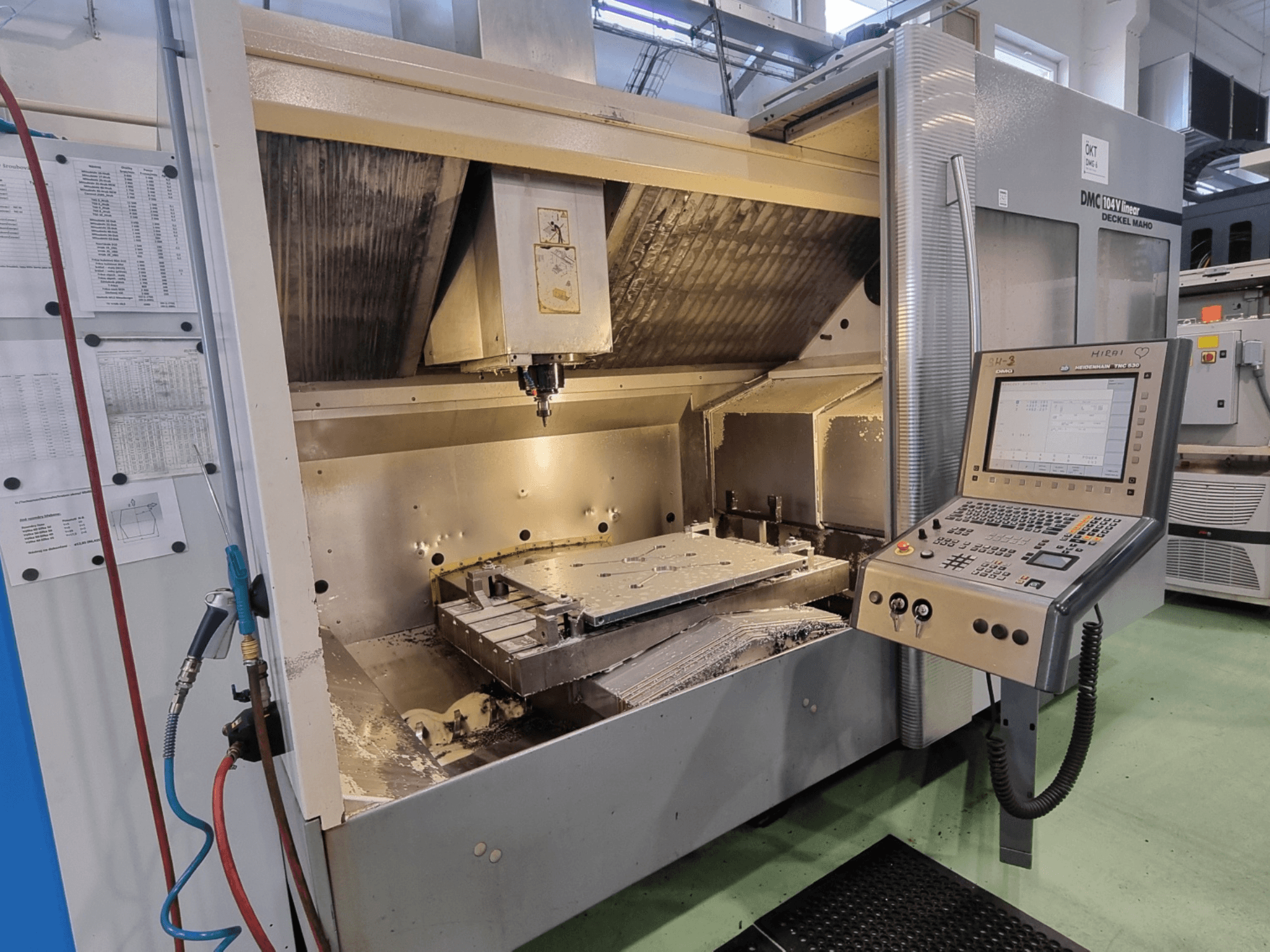DMG DECKEL MAHO DMC 104V Linear vertical machining center, front view with control panel and machining area visible.