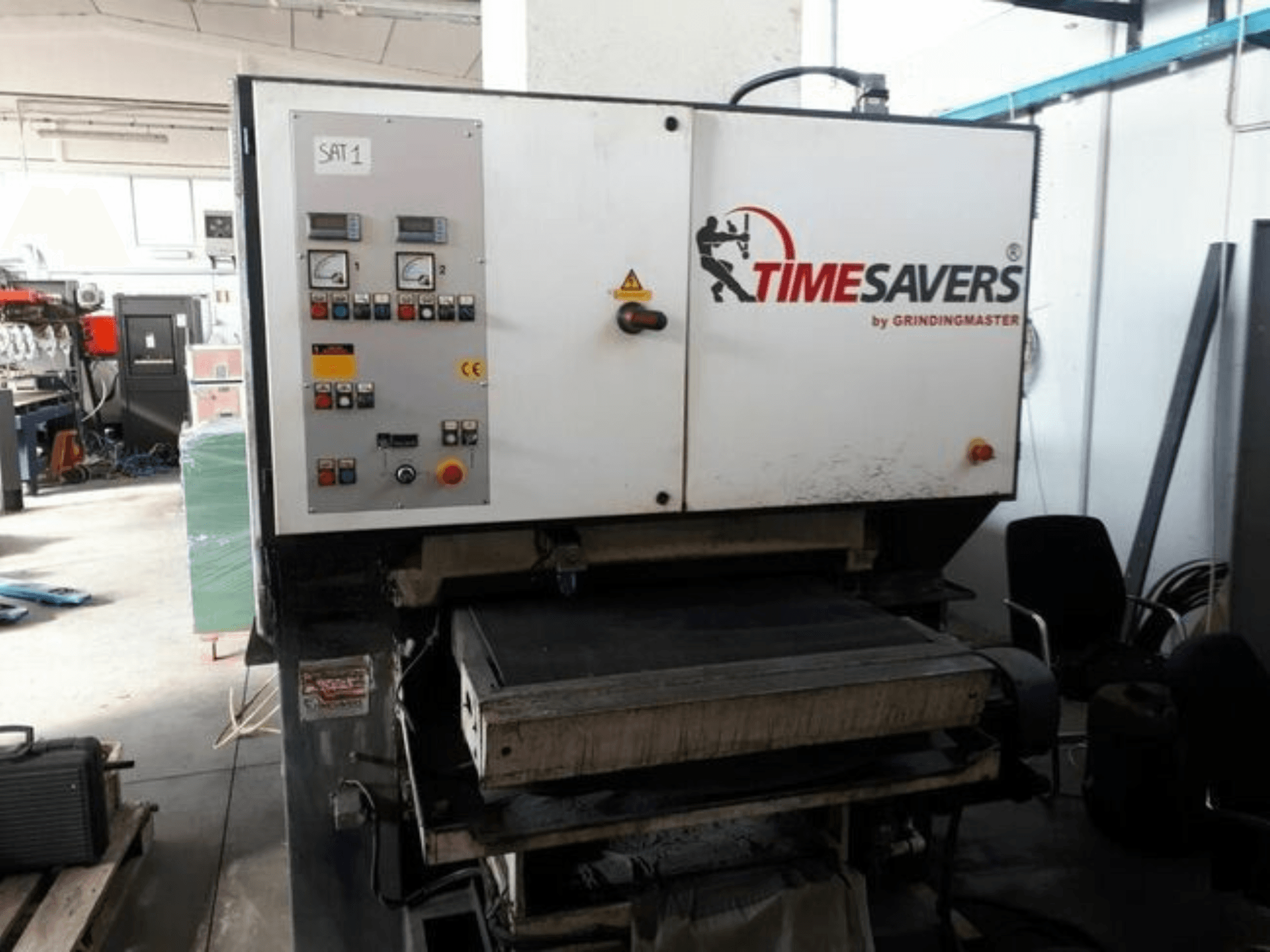 Front view of TIMESAVERS 41-SERIE-900-WW deburring machine, featuring control panel with knobs, buttons, and gauges.
