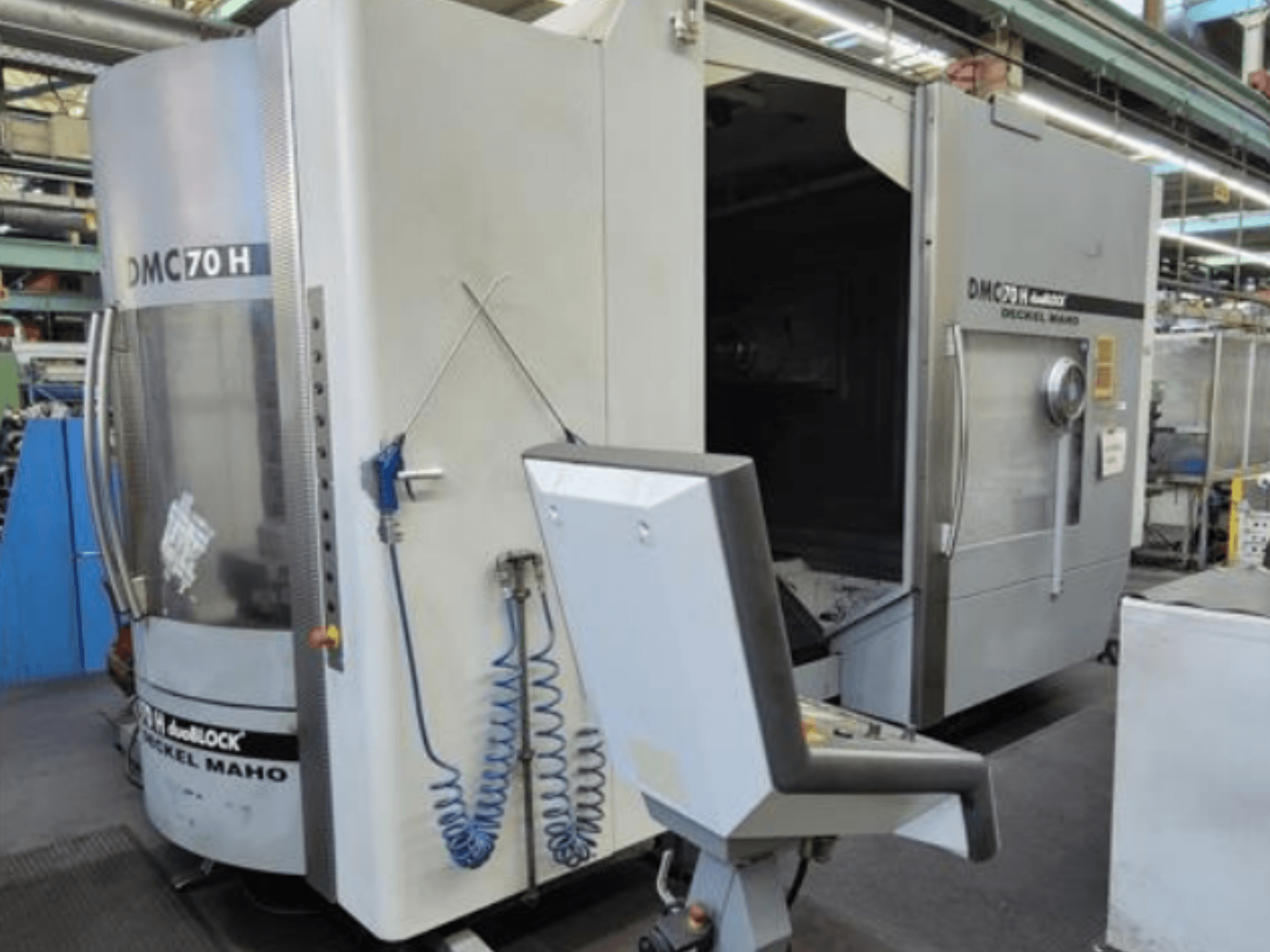 Front view of DECKEL MAHO DMC 70 H duoblock horizontal machining centre with control panel and visible machining area.