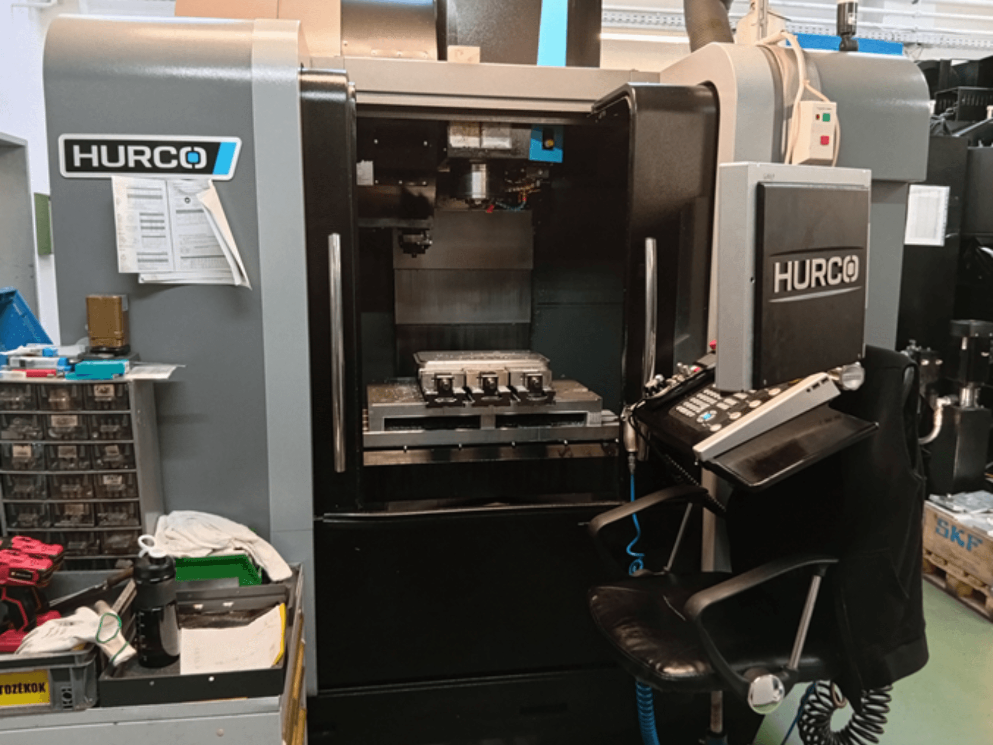 Hurco VMX 30i Vertical Machining Centre in front view, featuring control panel, worktable, and operational setup.