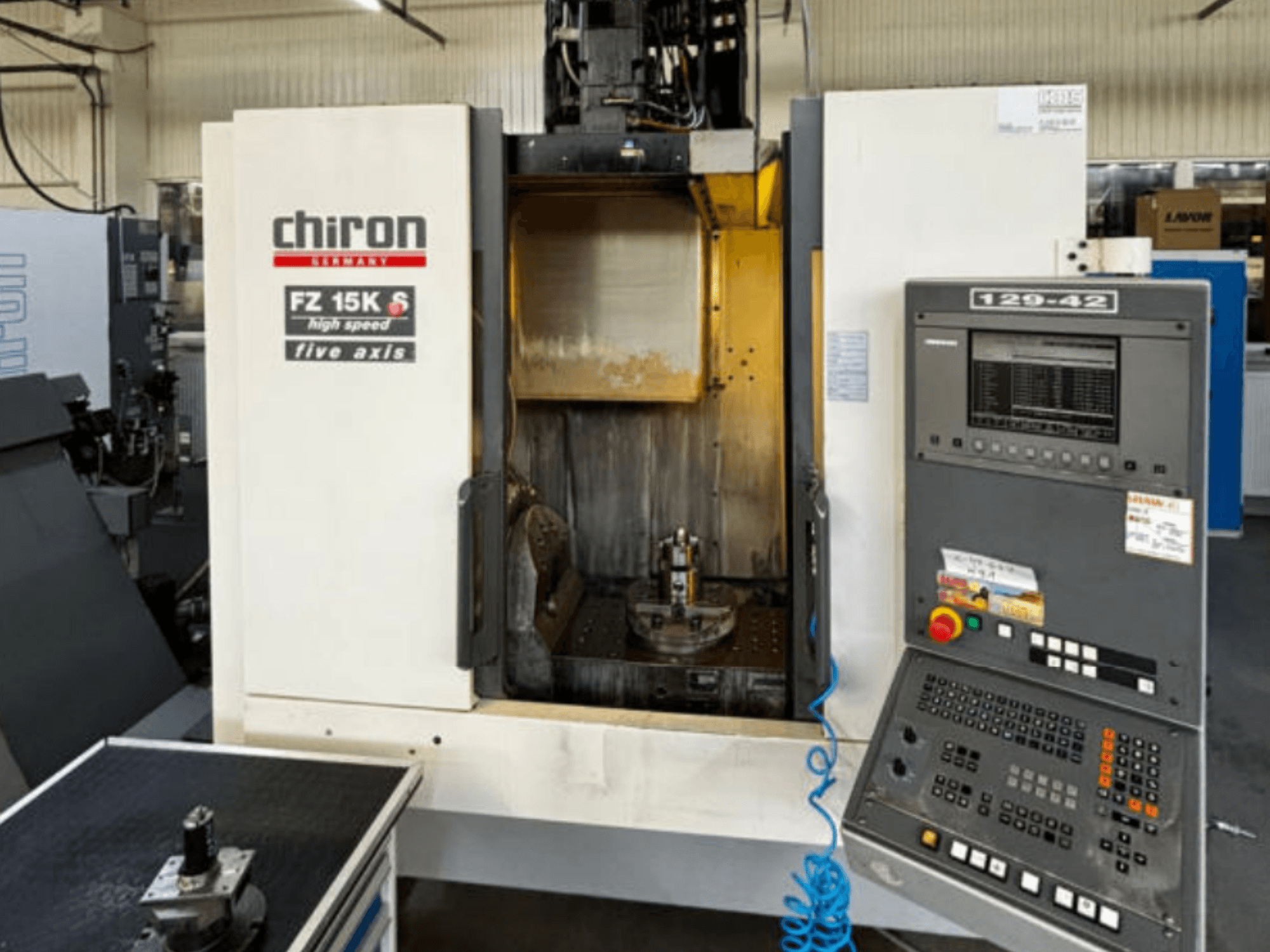 CHIRON FZ 15K S vertical machining center, front view, highlighting control panel and five-axis tool setup.