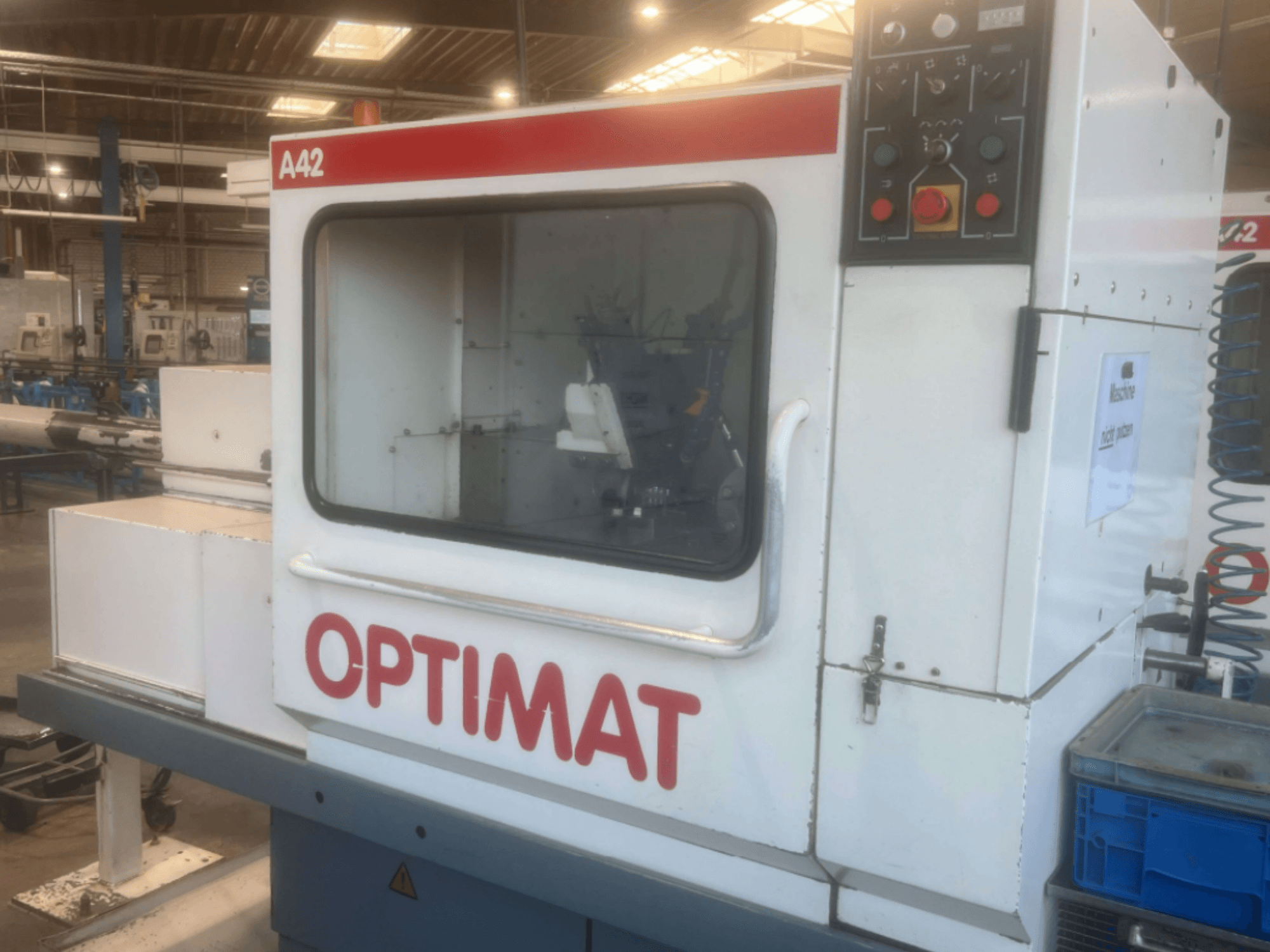 KOVOSVIT MAS OPTIMAT A42 horizontal turning machine, side view, showcasing control panel and large glass display.