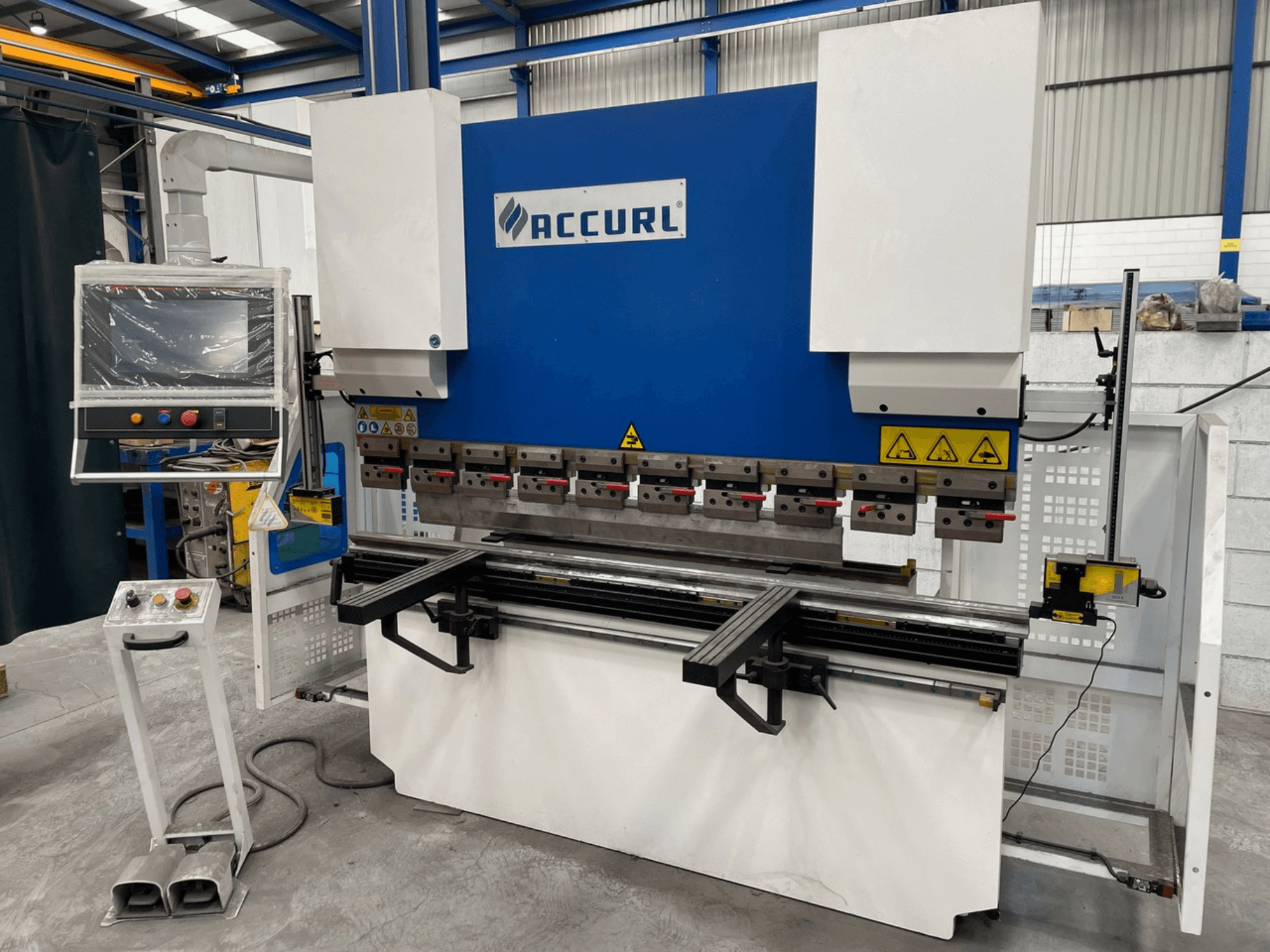 ACCURL M37-63Tx2000 press brake in front view with control panel, safety features, and bending tools visible.