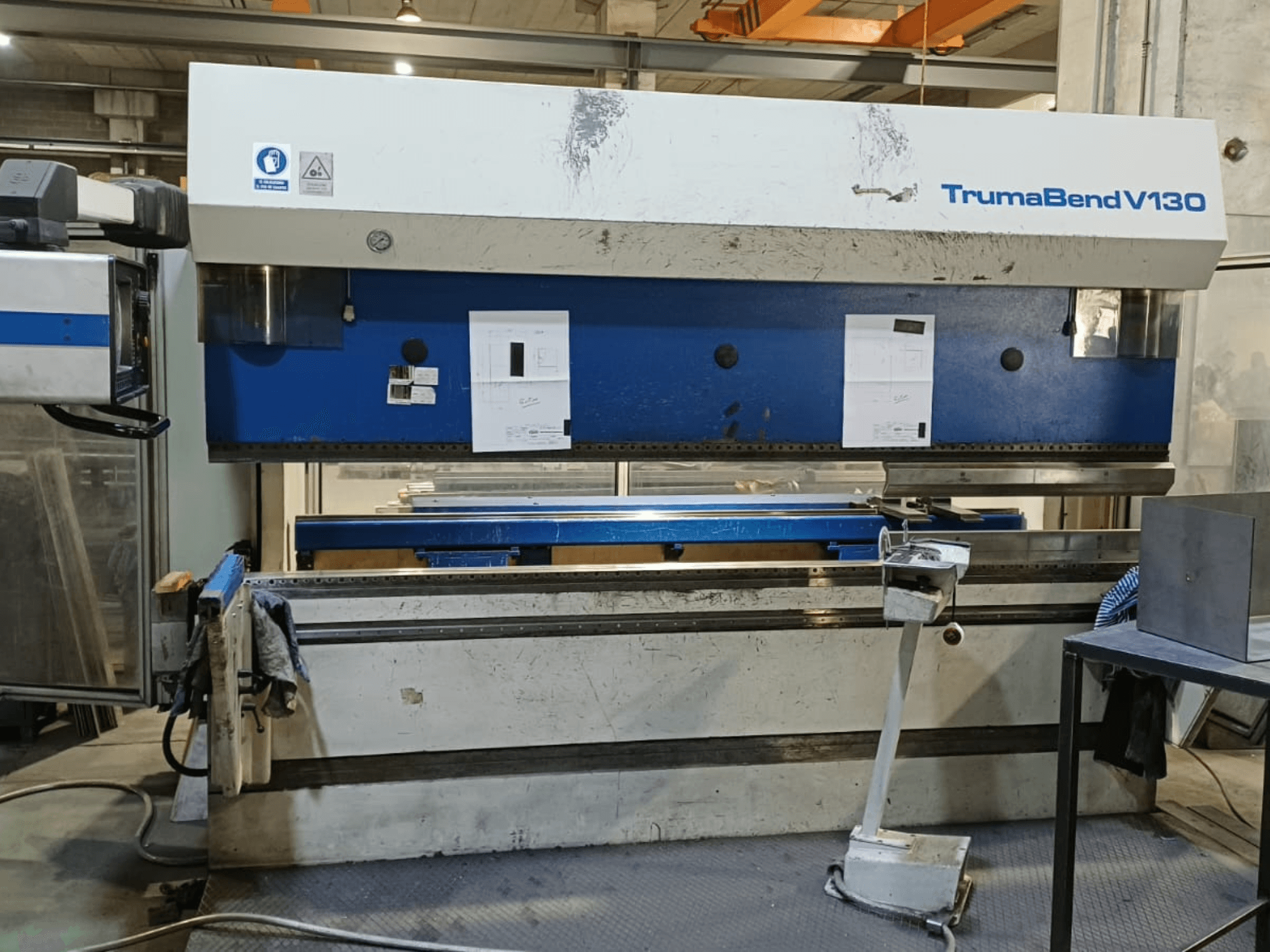 TRUMPF Trumatic Trumabend V130 press brake in front view, showing control panel, work surface, and adjustable tools.