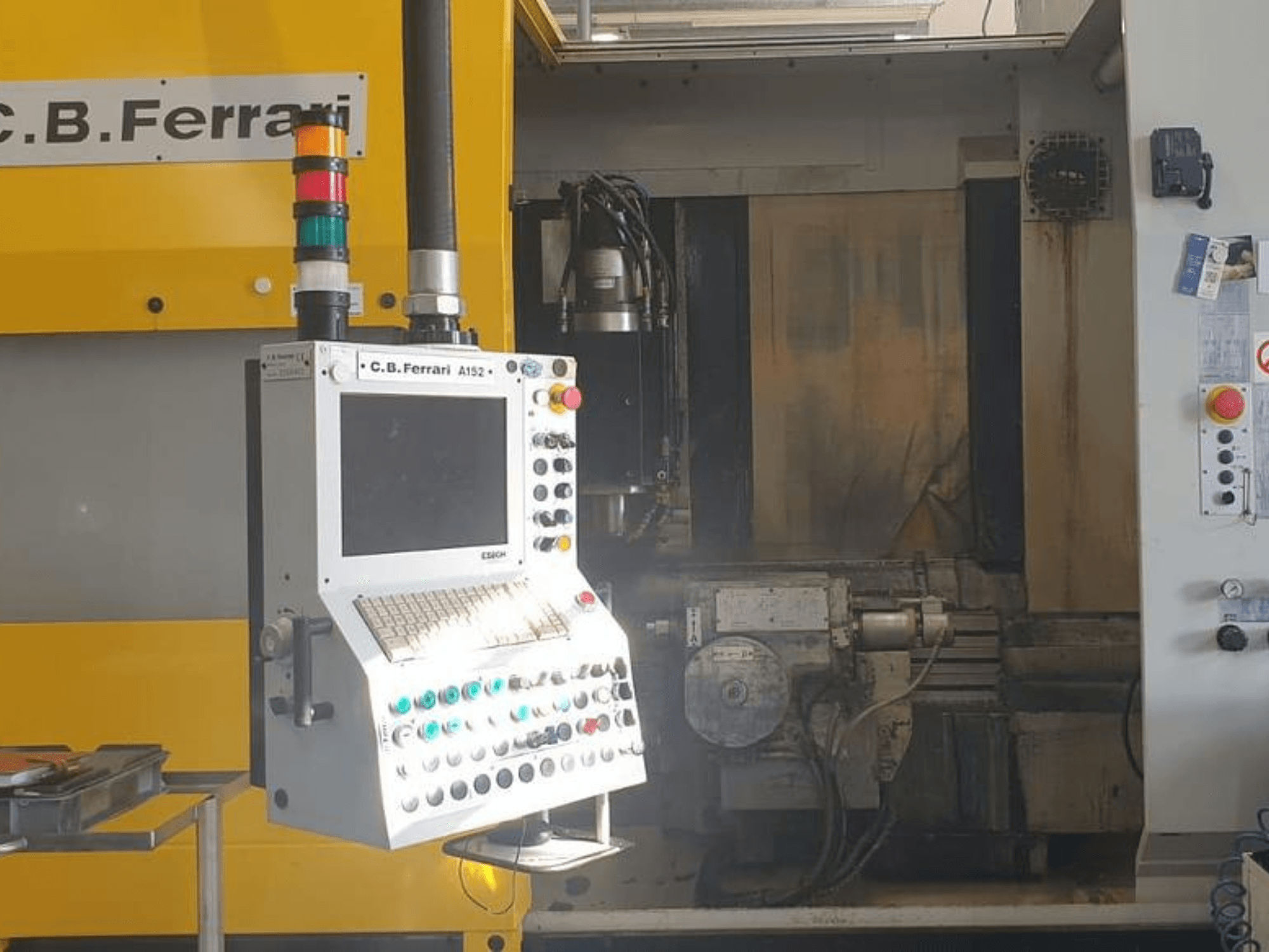 C.B. Ferrari A152 Vertical Machining Centre front view, showcasing control panel with buttons and on-machine motor components.