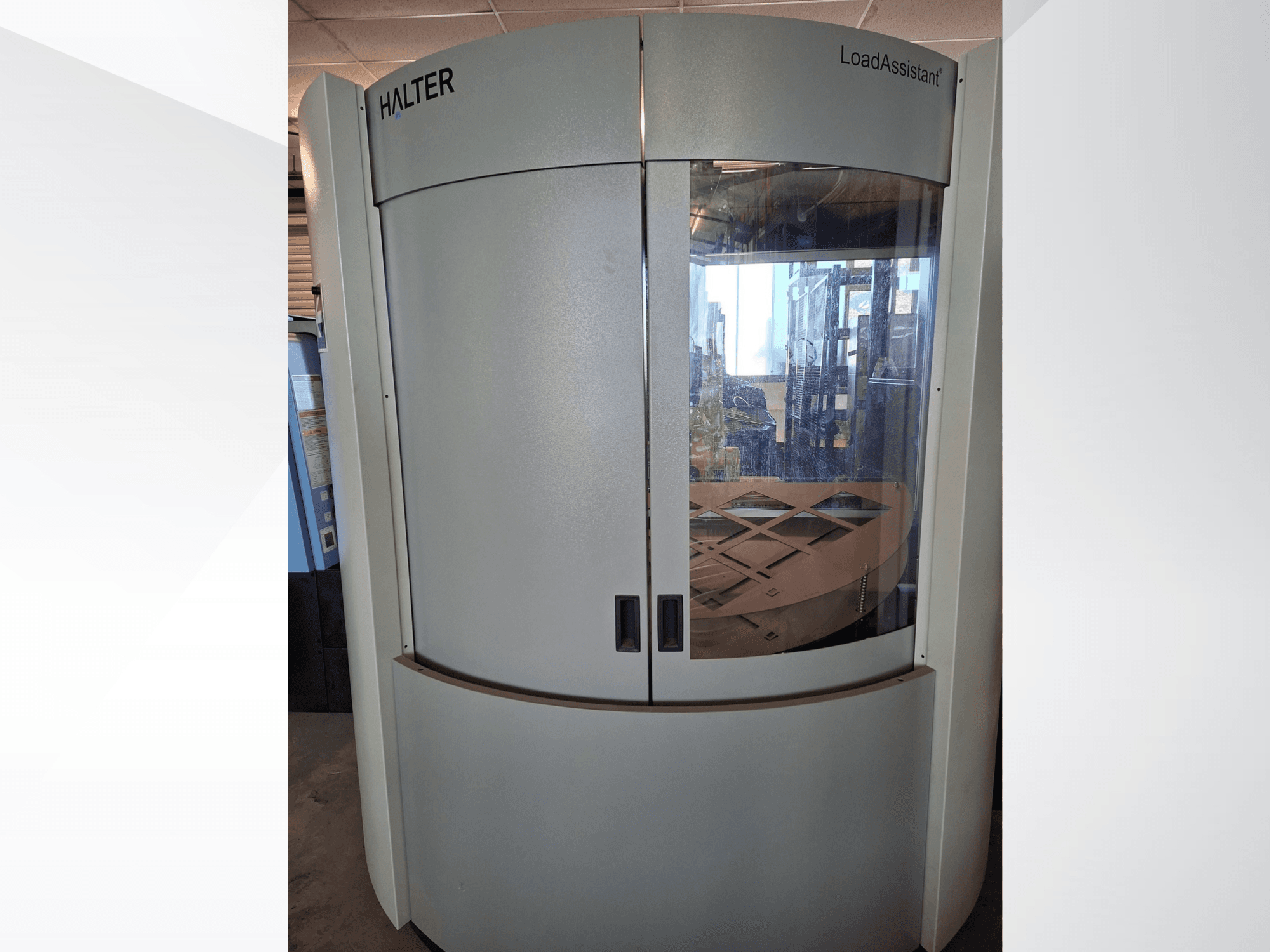 HALTER LoadAssistant Universal Big 70 robot arm, front view, showing a sleek design with transparent doors and interior loading platform.