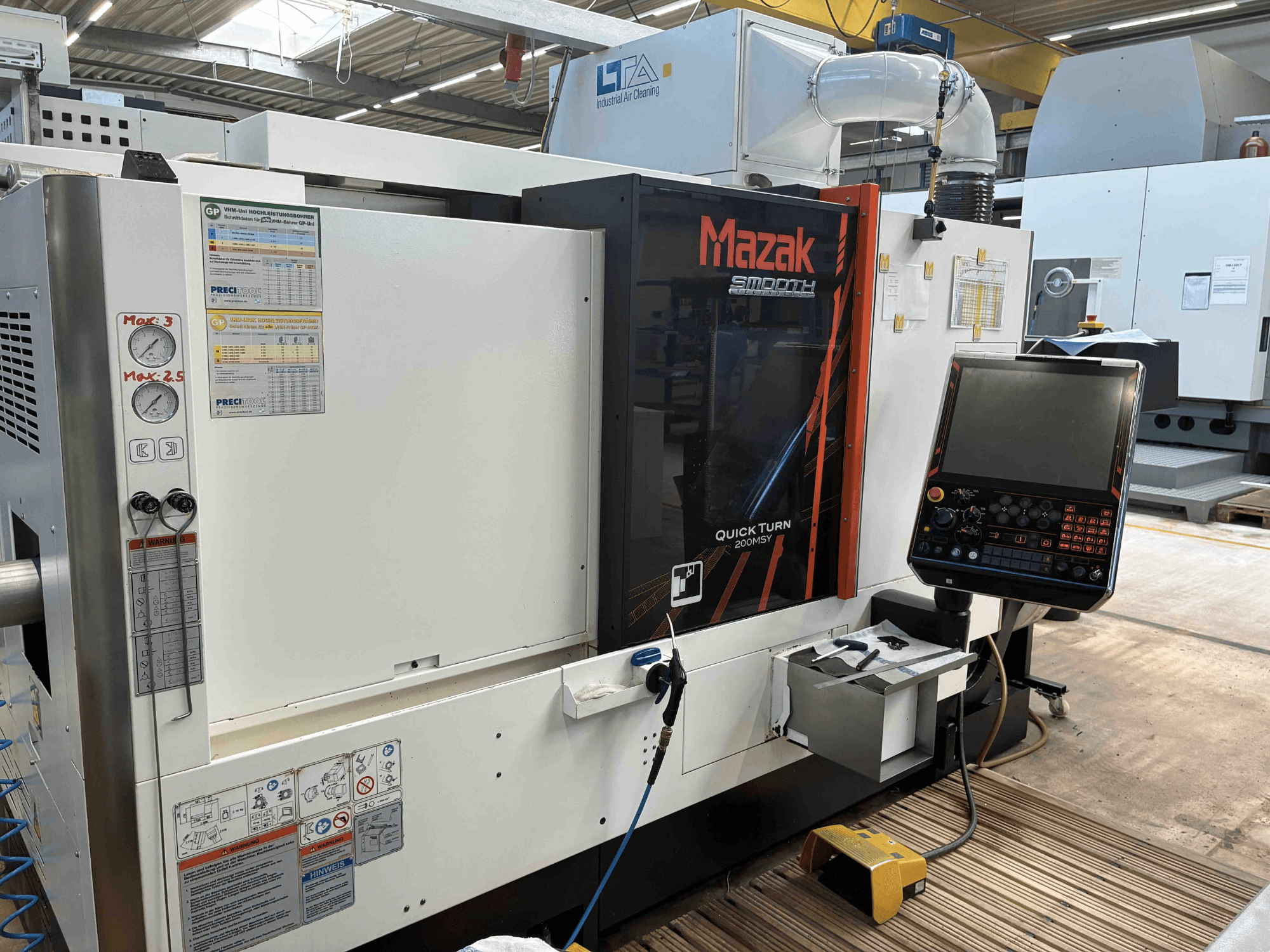 Mazak Quick Turn Smooth 200MSY turn-mill center, front view showing control panel and operational gauges.