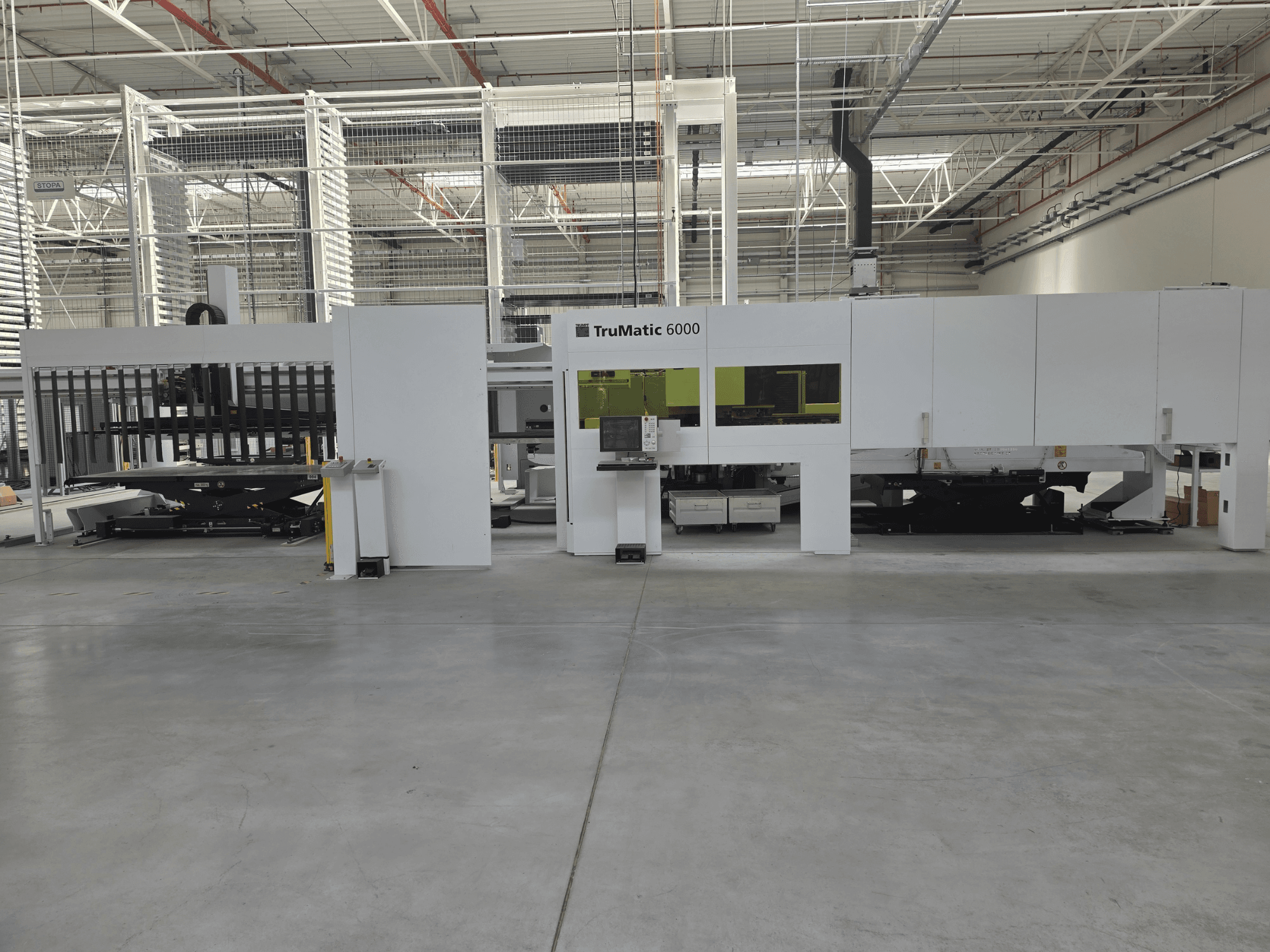 TRUMPF TruMatic 6000 Automated Sheet Metal Production System, front view, featuring control panel and loading area.