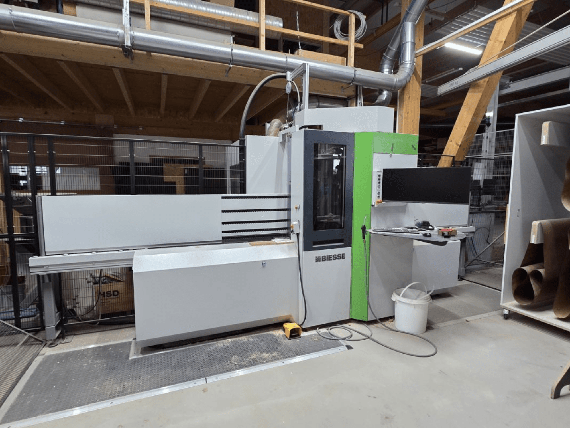BIESSE Brema EKO 2.2 CNC Processing Center, front view, showcasing control panel and main housing with green accents.