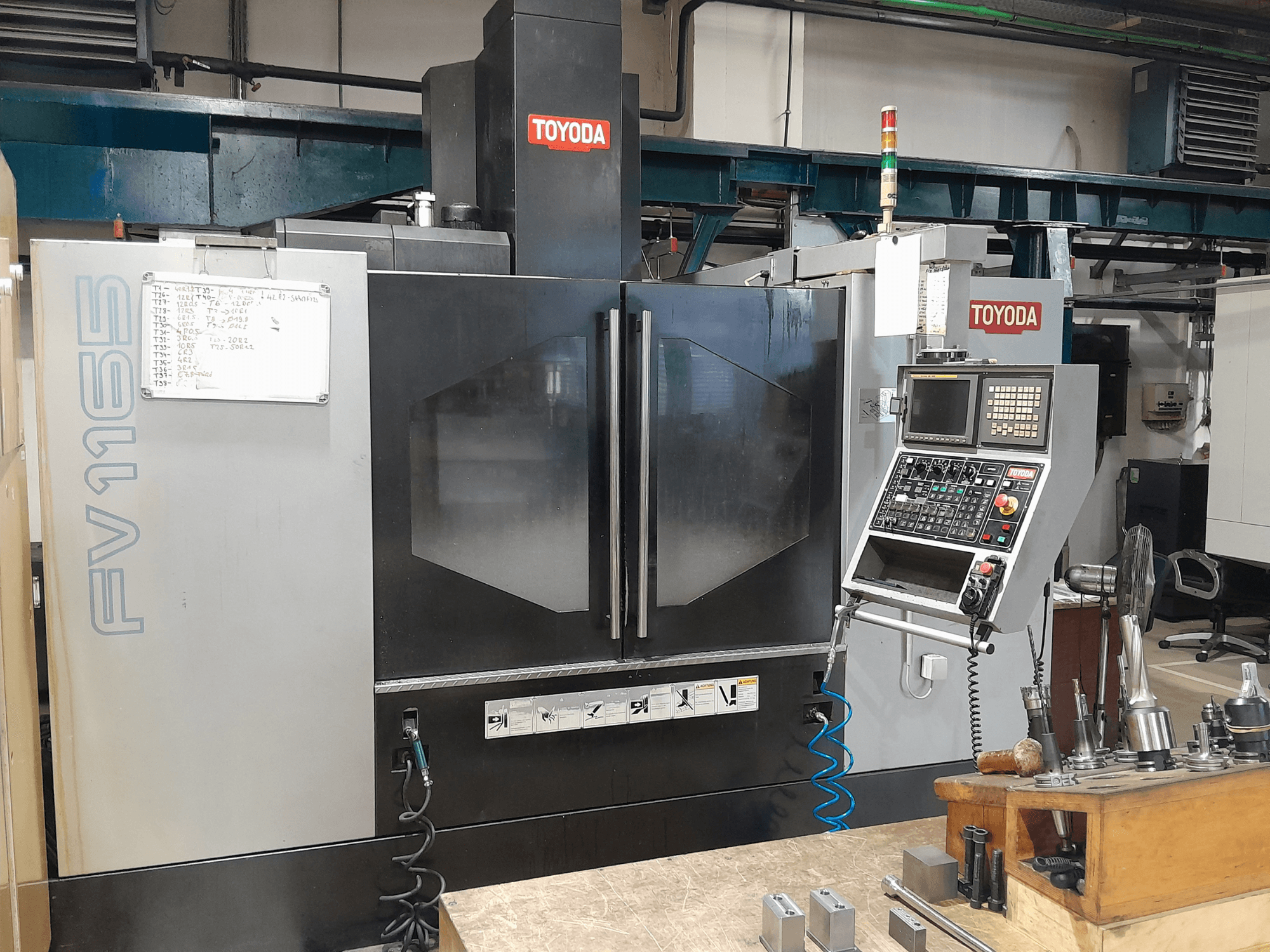 TOYODA FV 1165 Vertical Machining Centre, front view, showcasing control panel and operational indicators.