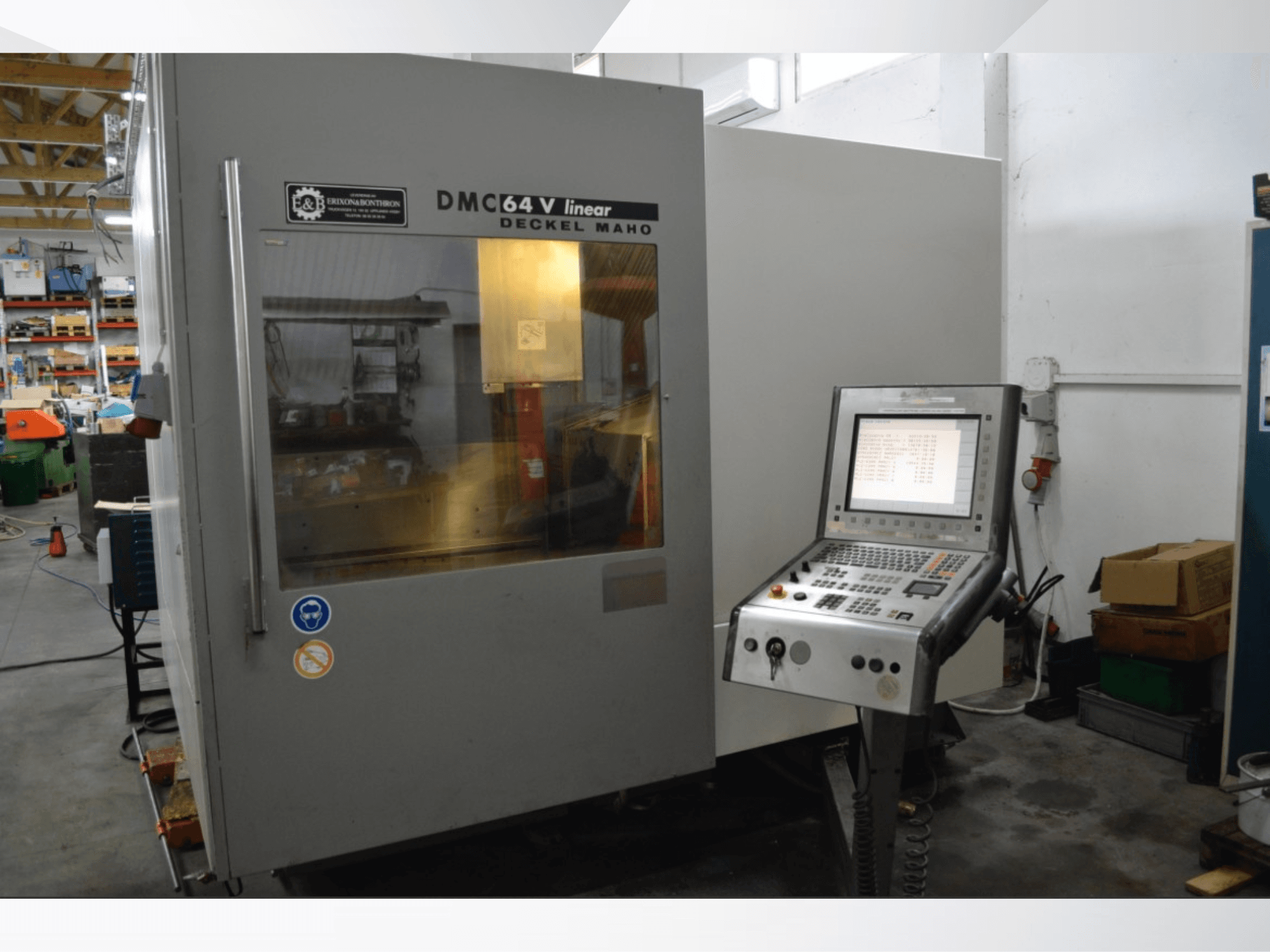 DMG DECKEL MAHO DMC 64V Linear vertical machining center, front view showcasing control panel and workspace.
