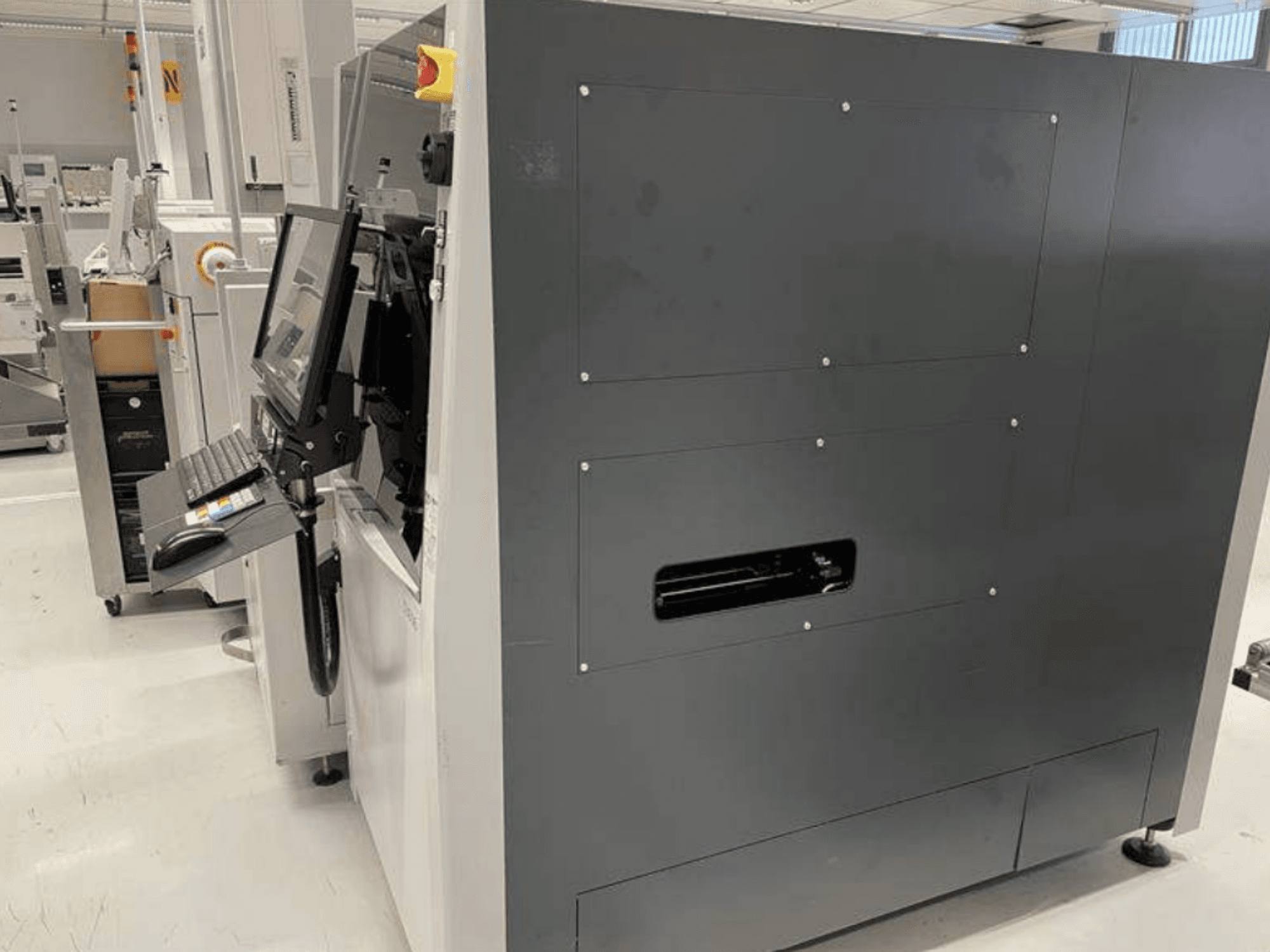 VISCOM S3016 Optical Measurement Machine, side view, featuring a monitor, keyboard, and button interface for precision measurement.