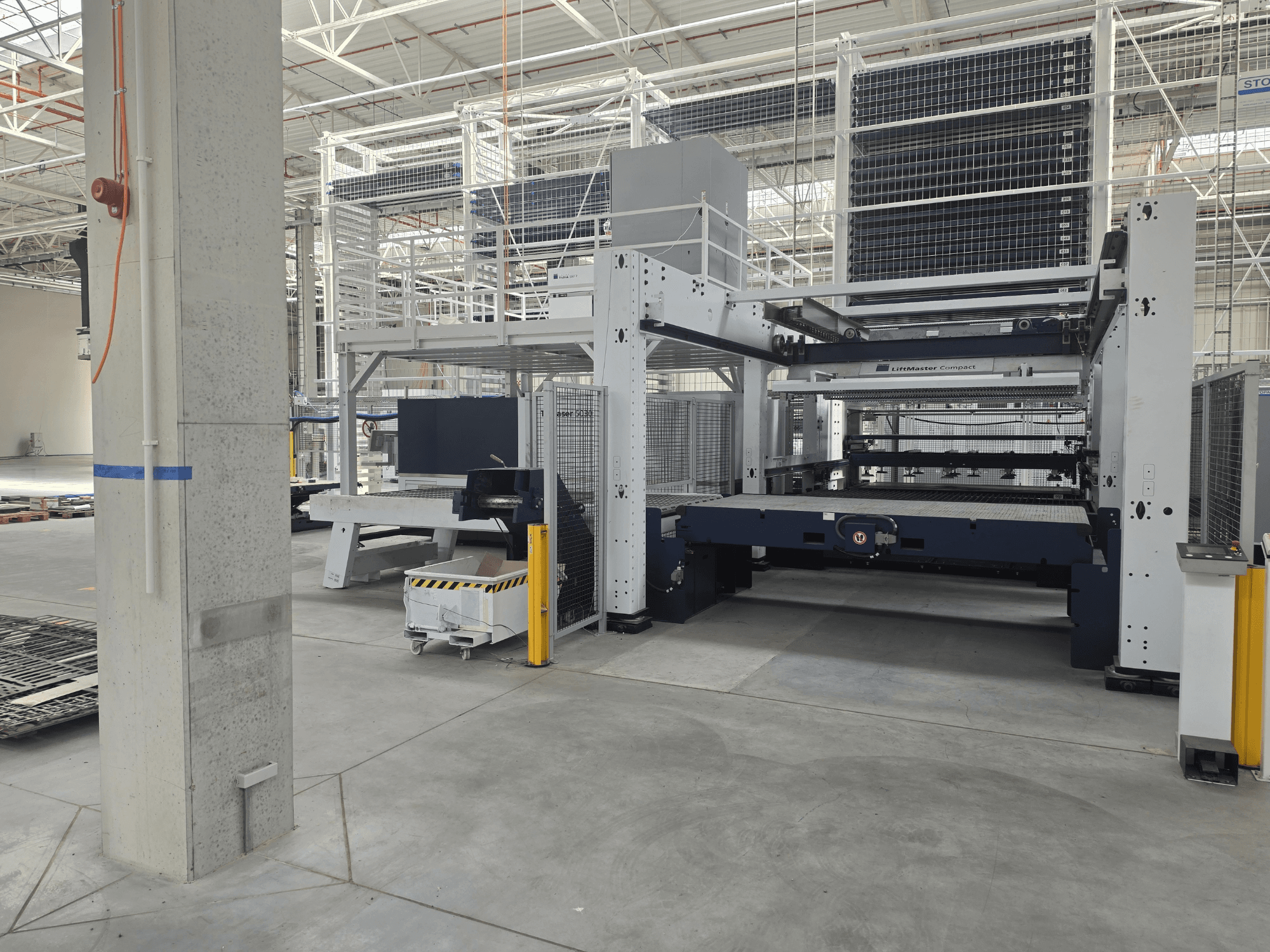 TRUMPF TruLaser 5030 fiber L76 FMC front view, showcasing the fiber laser cutting machine in a spacious industrial setting.
