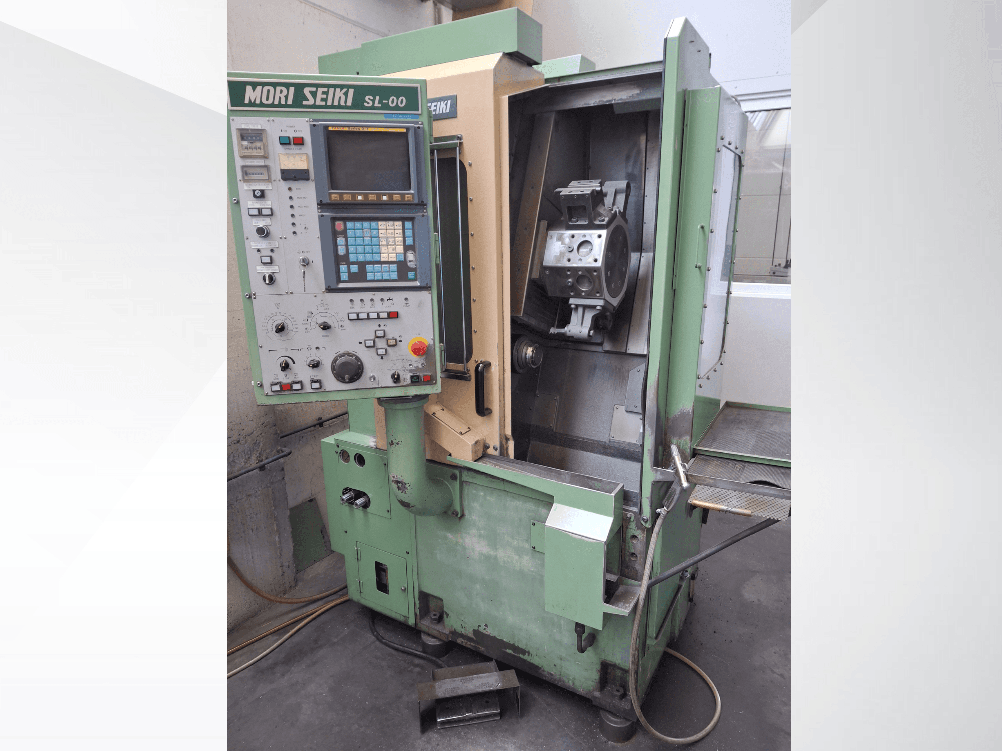 Horizontal turning machine DMG Mori Seiki SL-00, showing control panel and open front view of working area with a visible workpiece.