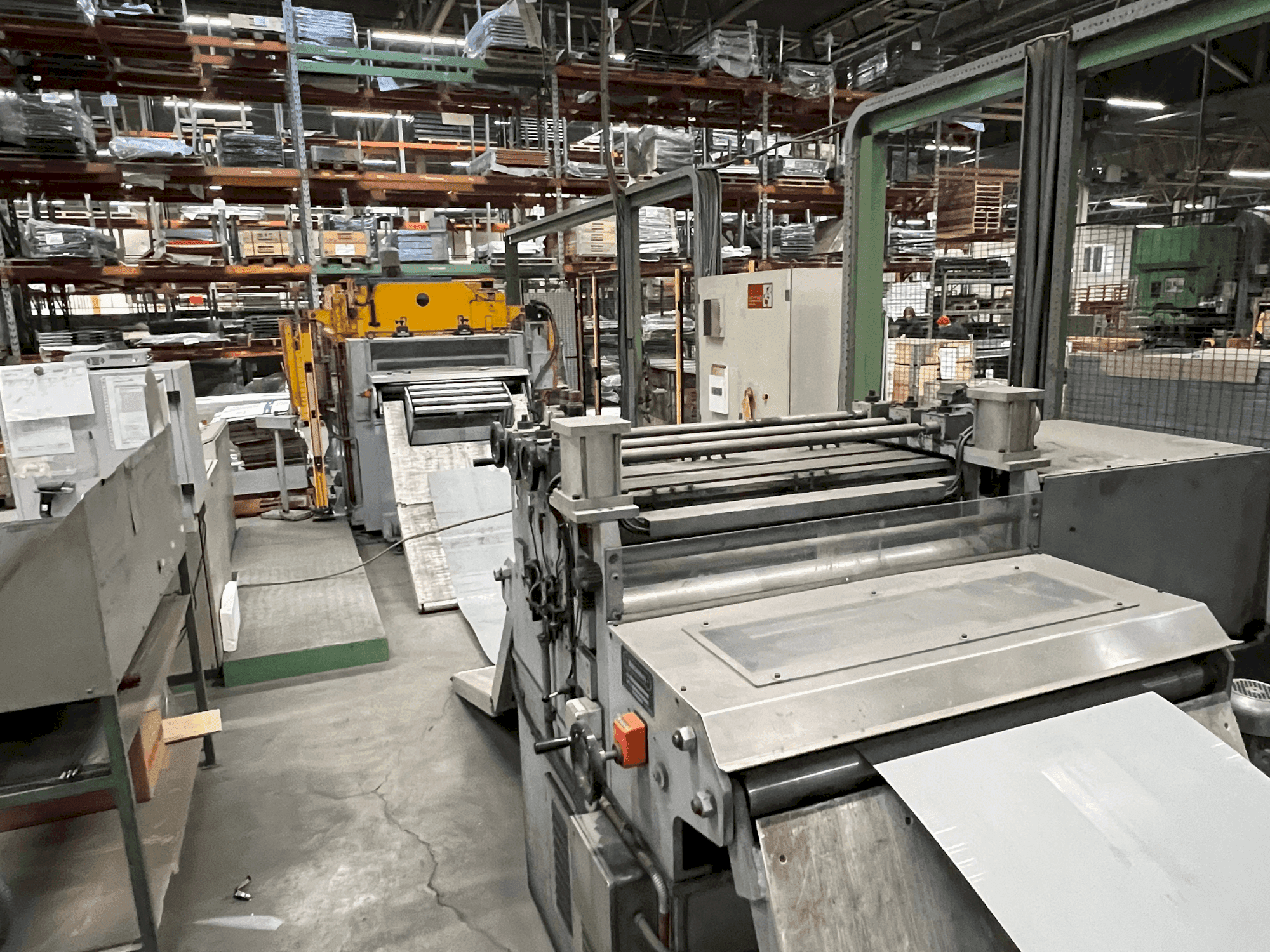 Front view of MECASTEEL Coil Press Feeding Line machine