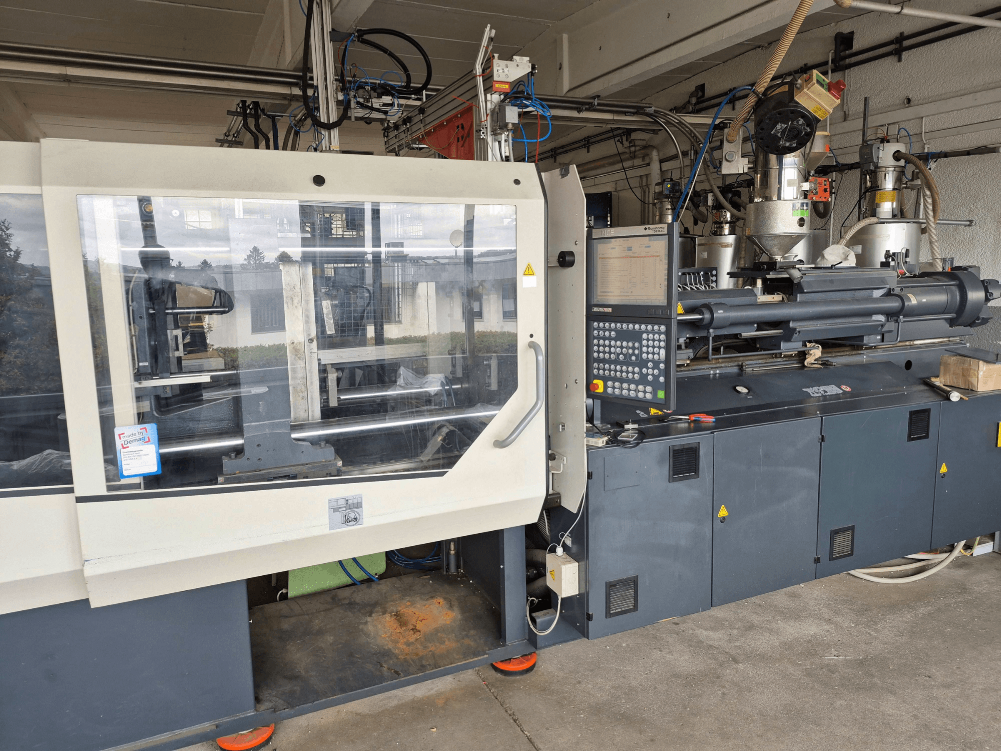 Hydraulic Injection Moulding Machine, SUMITOMO SHI DEMAG Systec 210/580-1450, front view with control panel and visible components.