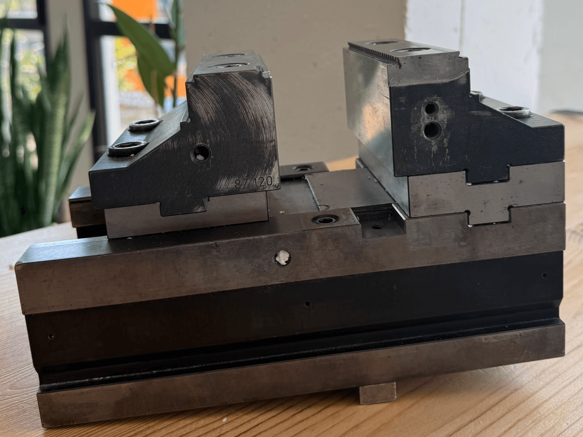 TRIGO SCS 120-250 machine tool clamp, side view, showcasing dual gripping surfaces and multiple fastening holes for secure attachment.