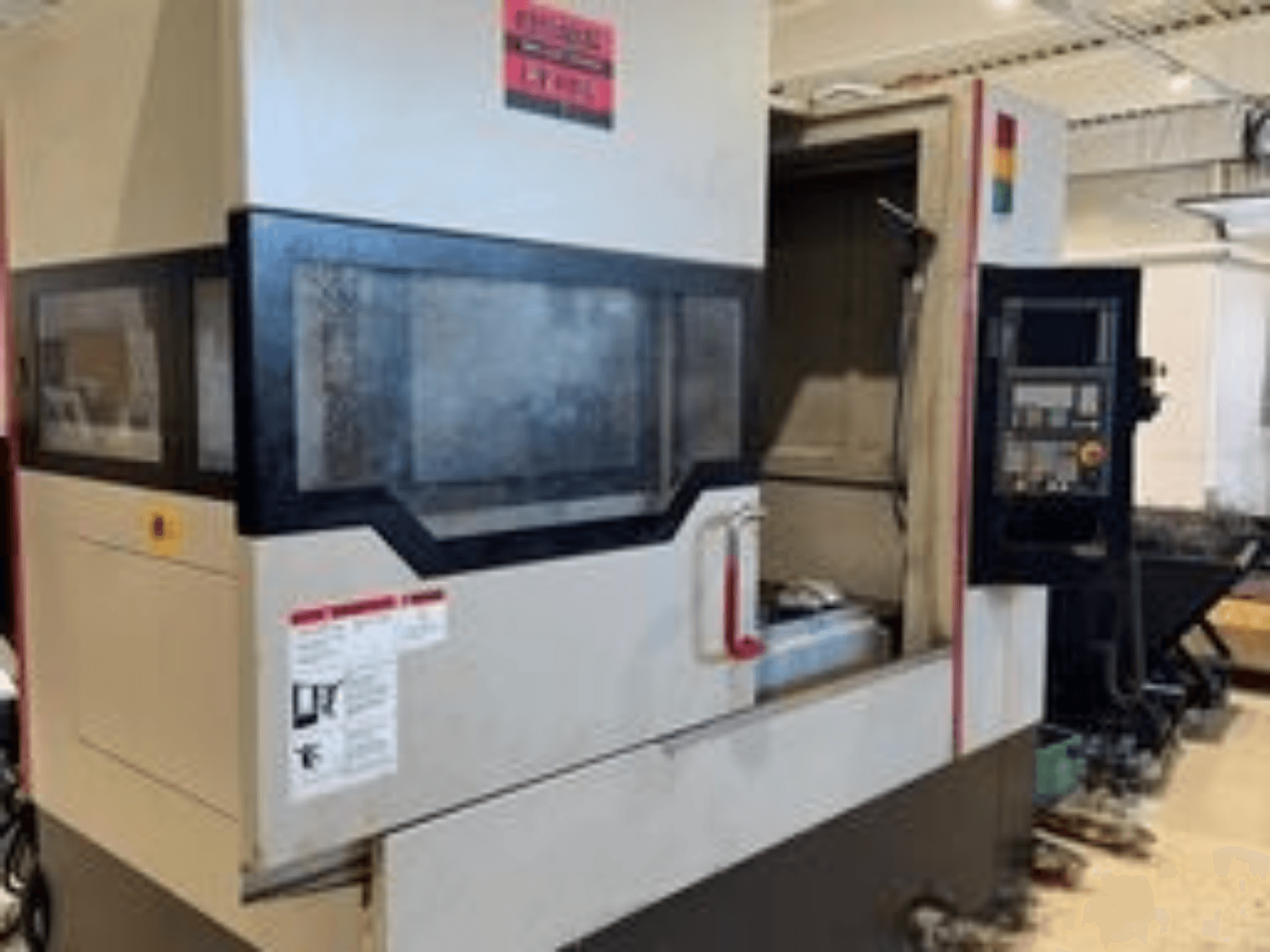 Front view of Quaser MV184P/12B Vertical Machining Centre, featuring control panel and visible work area.